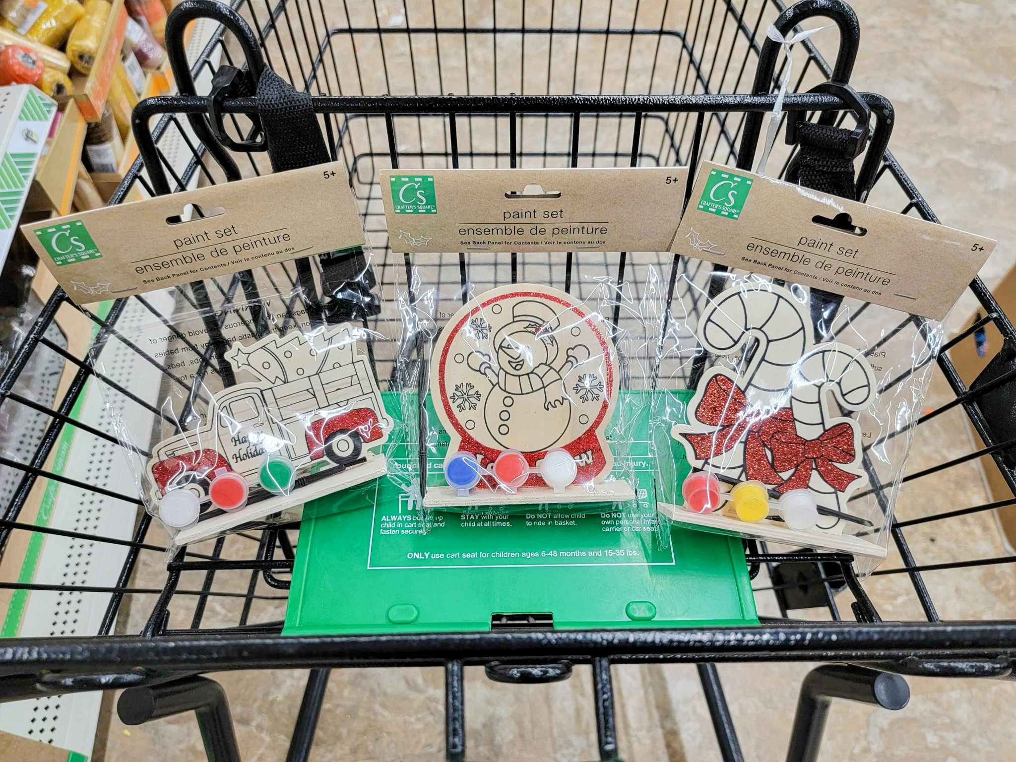 painting christmas craft sets in a cart