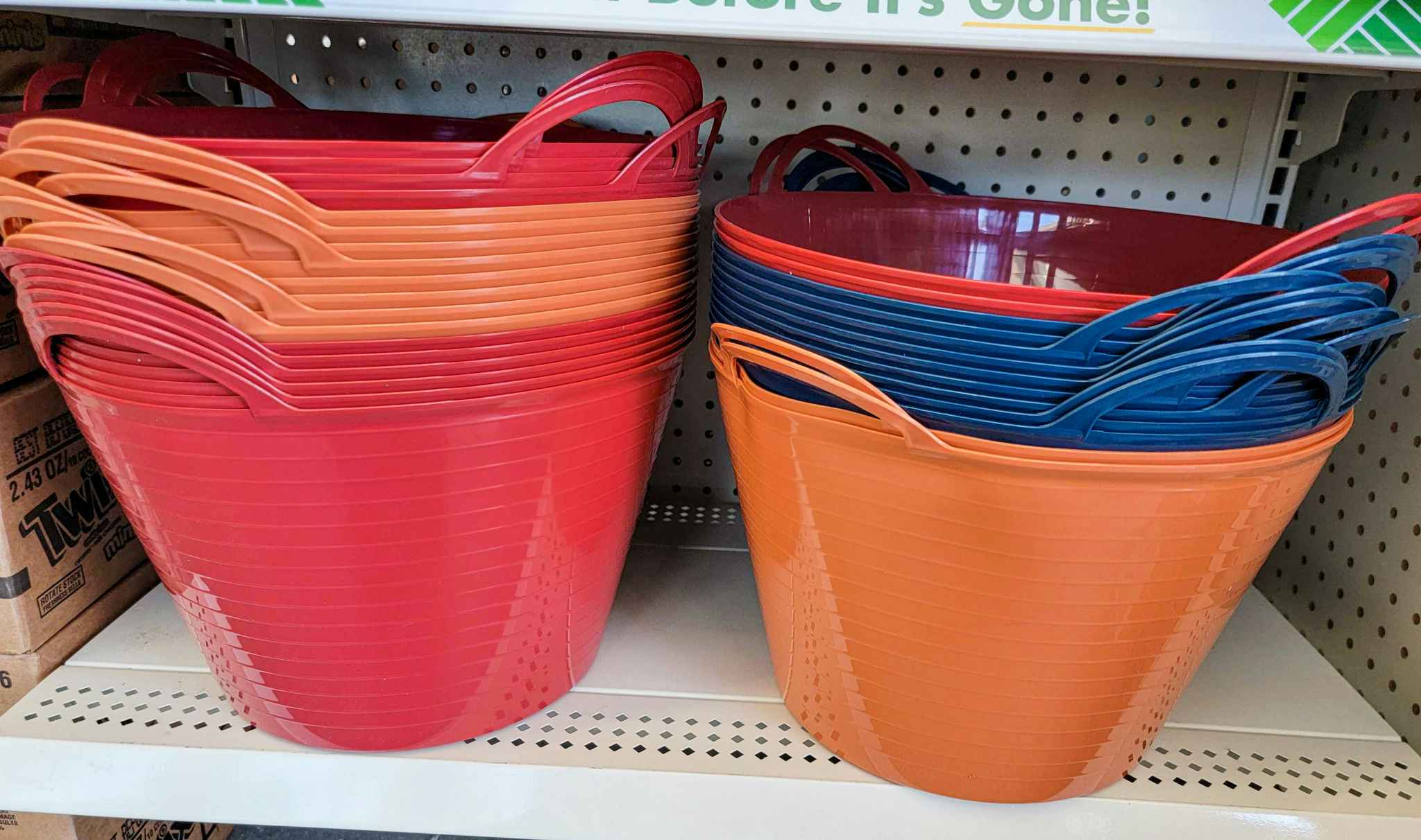 round storage bins with handles, in red, rust, and navy