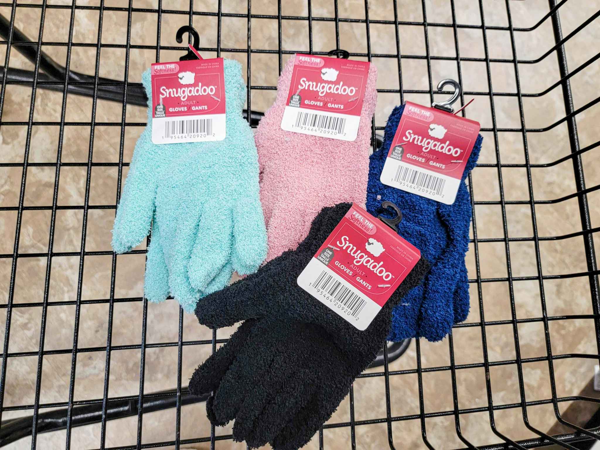 four pairs of adult fuzzy gloves in a cart
