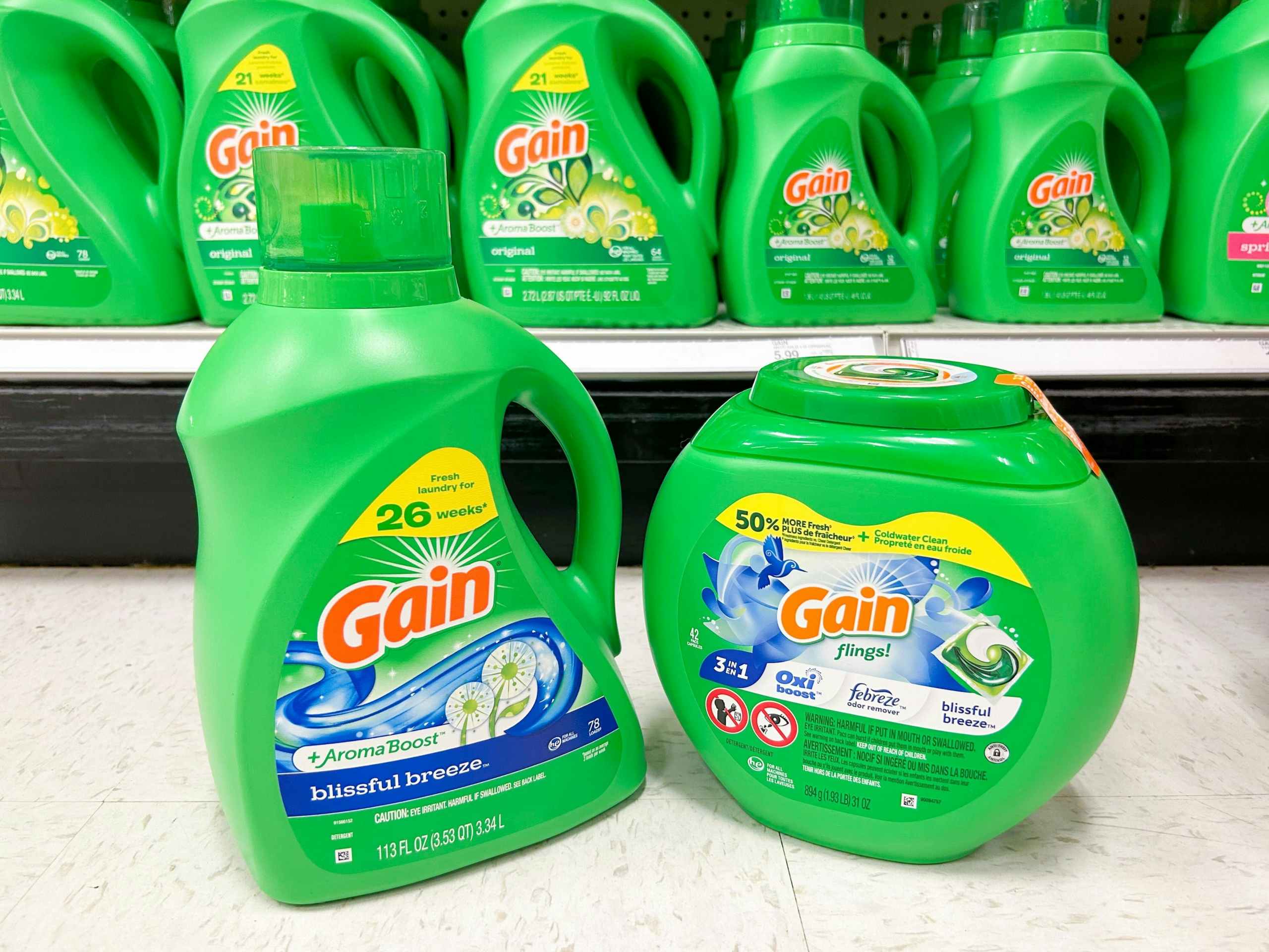 Gain detergent and flings on the floor in front of a store shelf