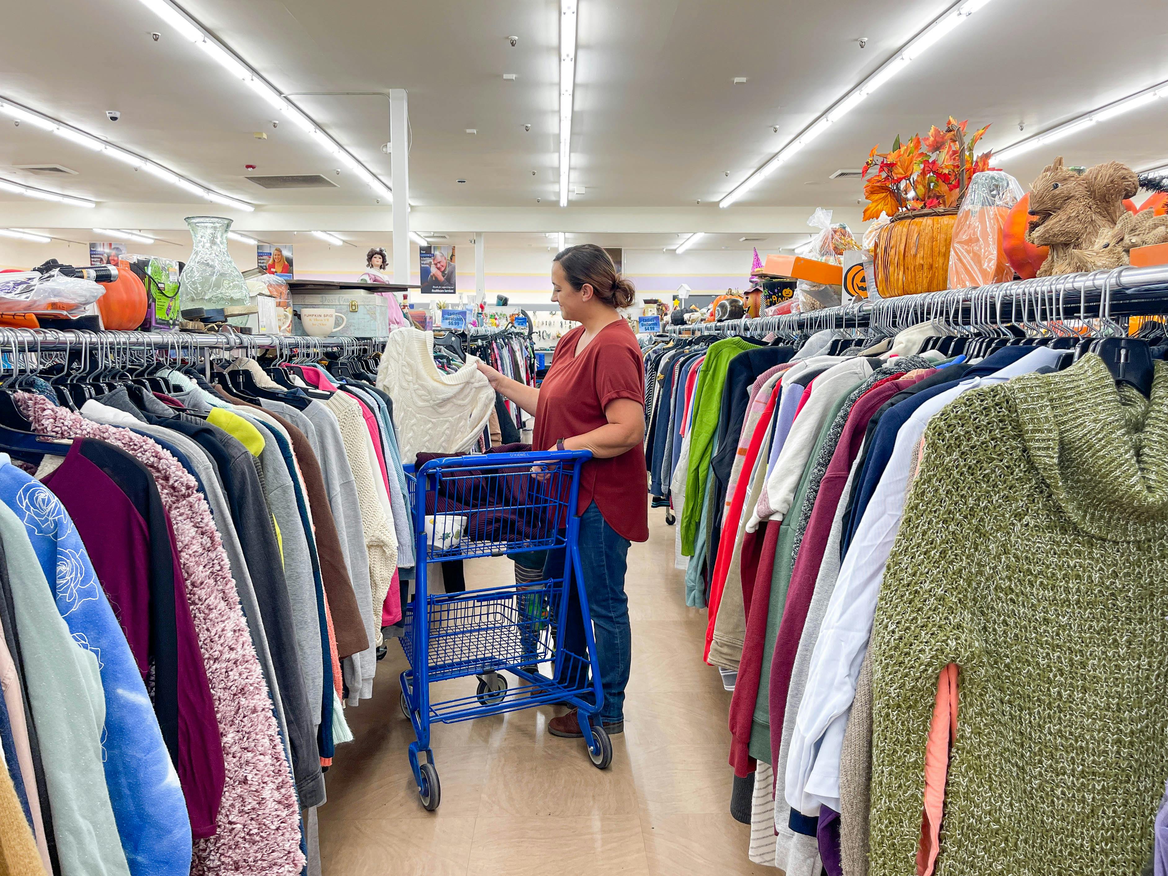 a woman shopping in the woman clothing aisles
