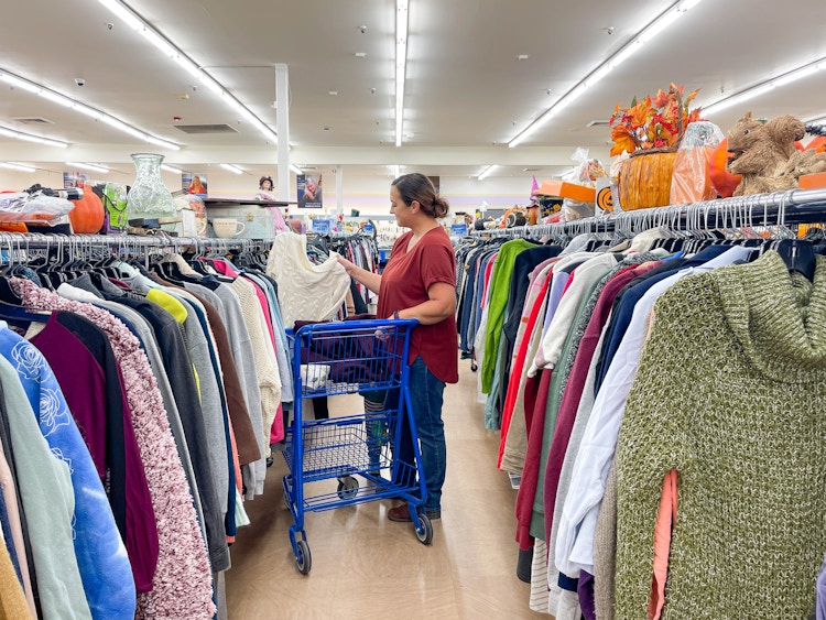 a woman shopping in the woman clothing aisles