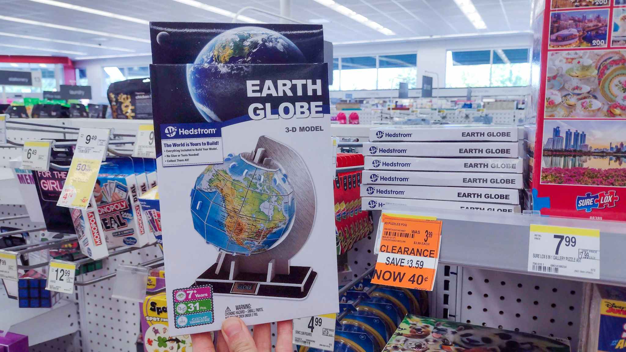 hand holding earth globe