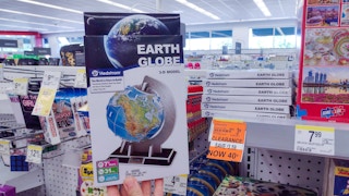 hand holding earth globe