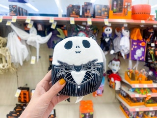 hand holding halloween squishmallow
