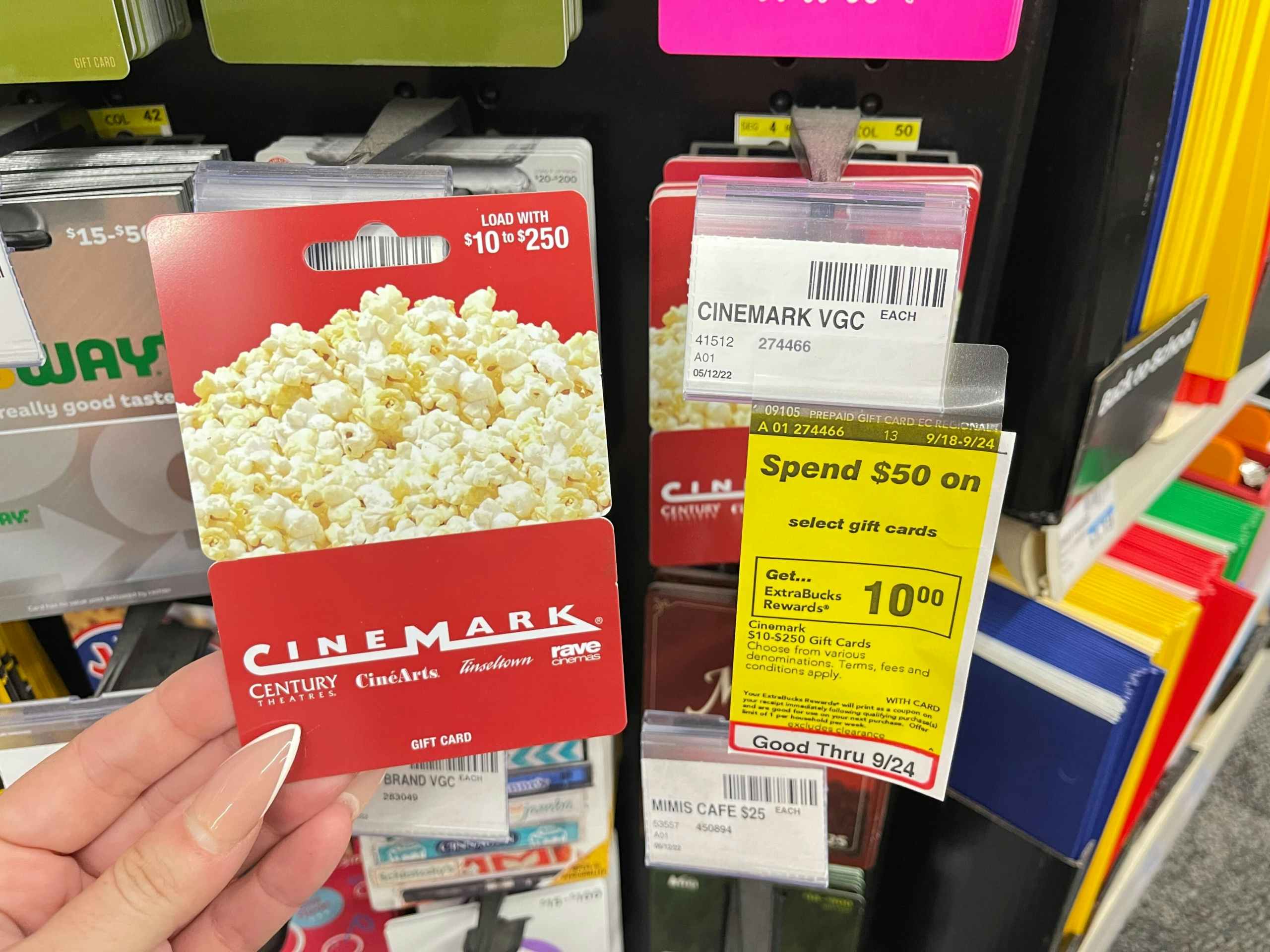 cinemark gift card next to spend $50 get $10 extrabucks sale tag