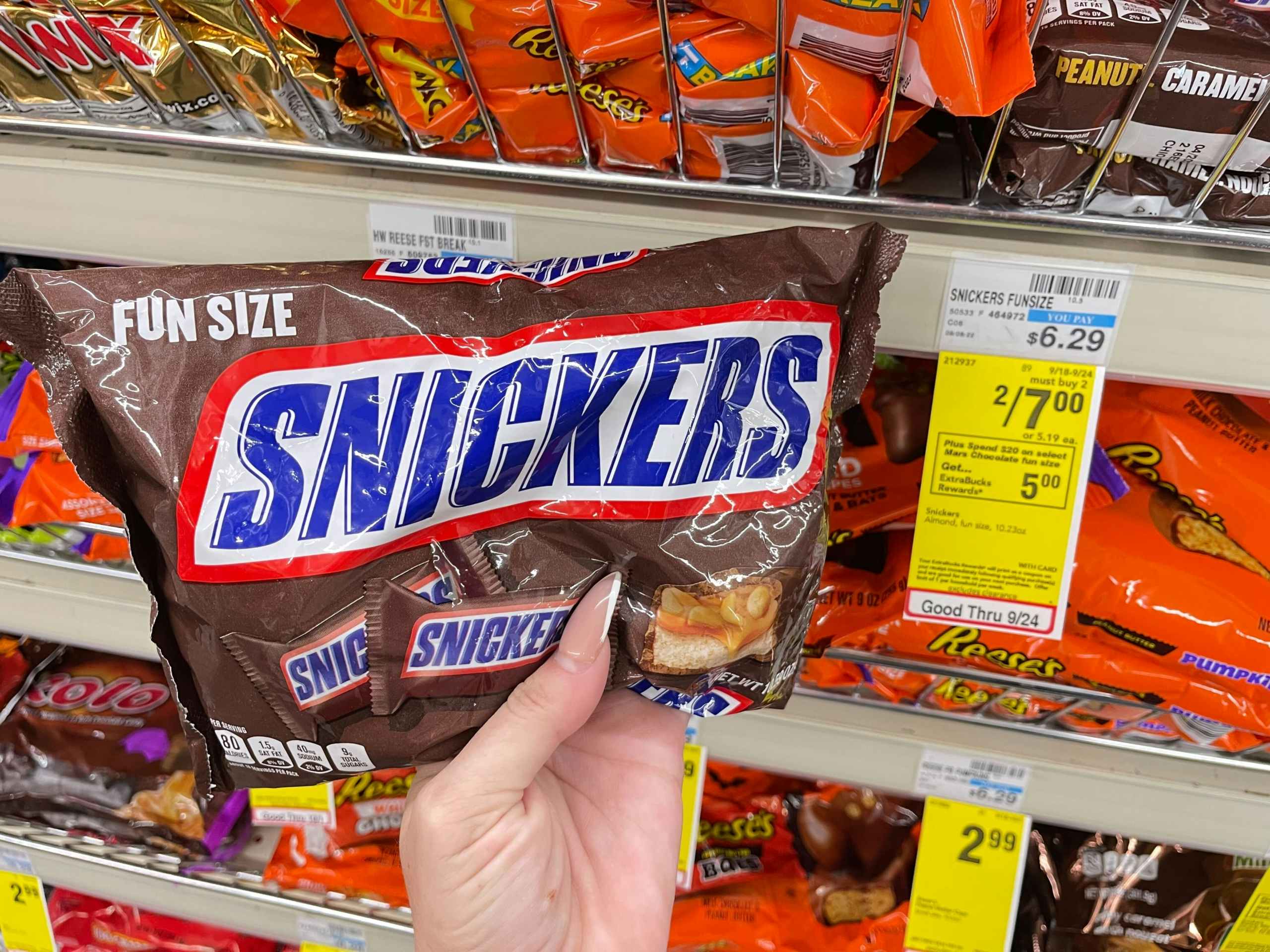 snickers fun size candy bars bag next to 2 for $7 cvs sales tag