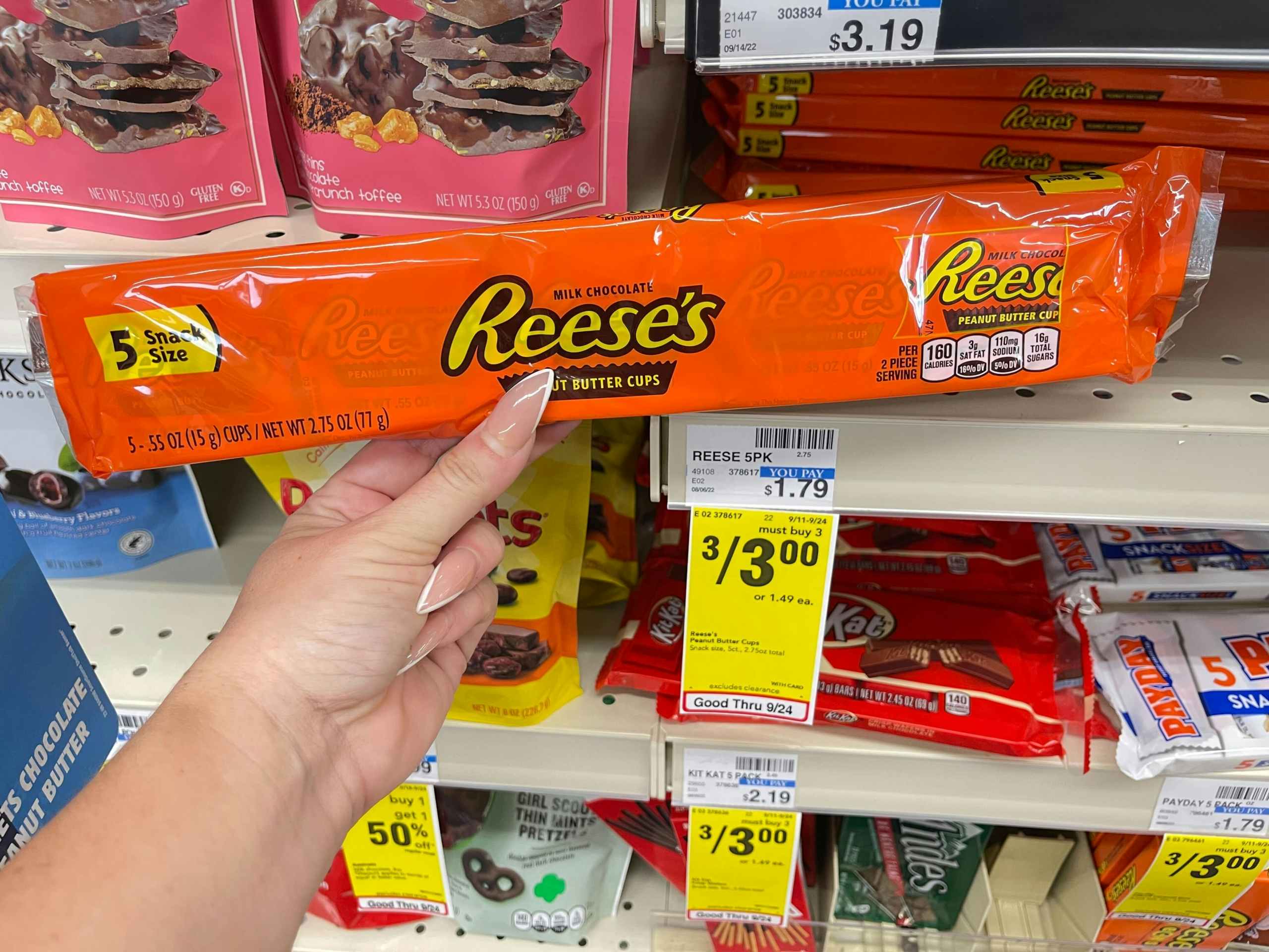 reeses snack size candy bars next to 3 for $3 cvs sales tag