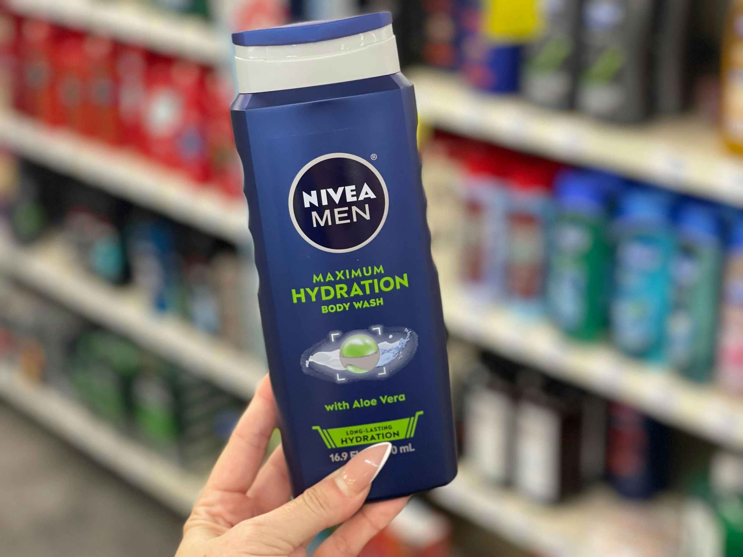 nivea body wash being held in a cvs aisle