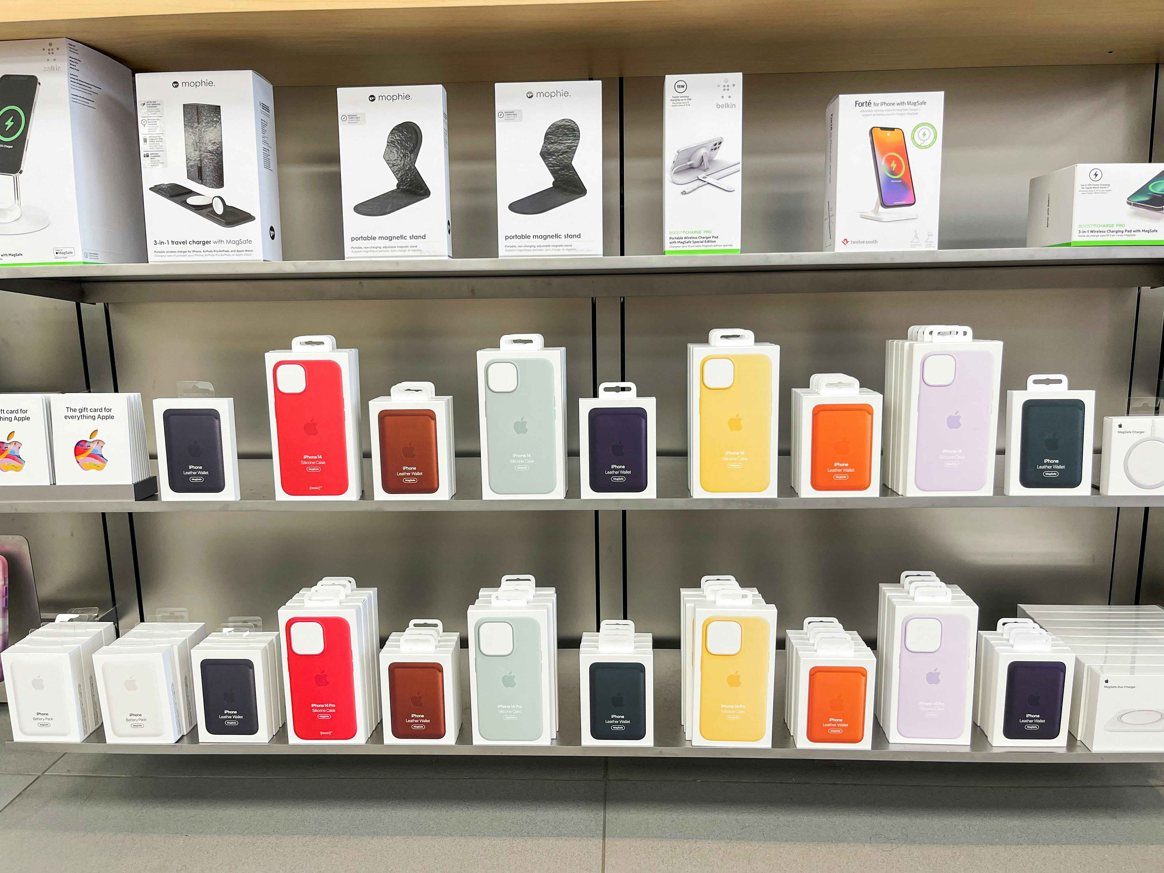 A shelf of apple products in an Apple store