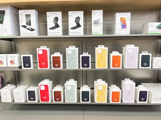 A shelf of apple products in an Apple store