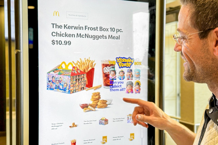 a person ordering a happy meal at mcdonalds