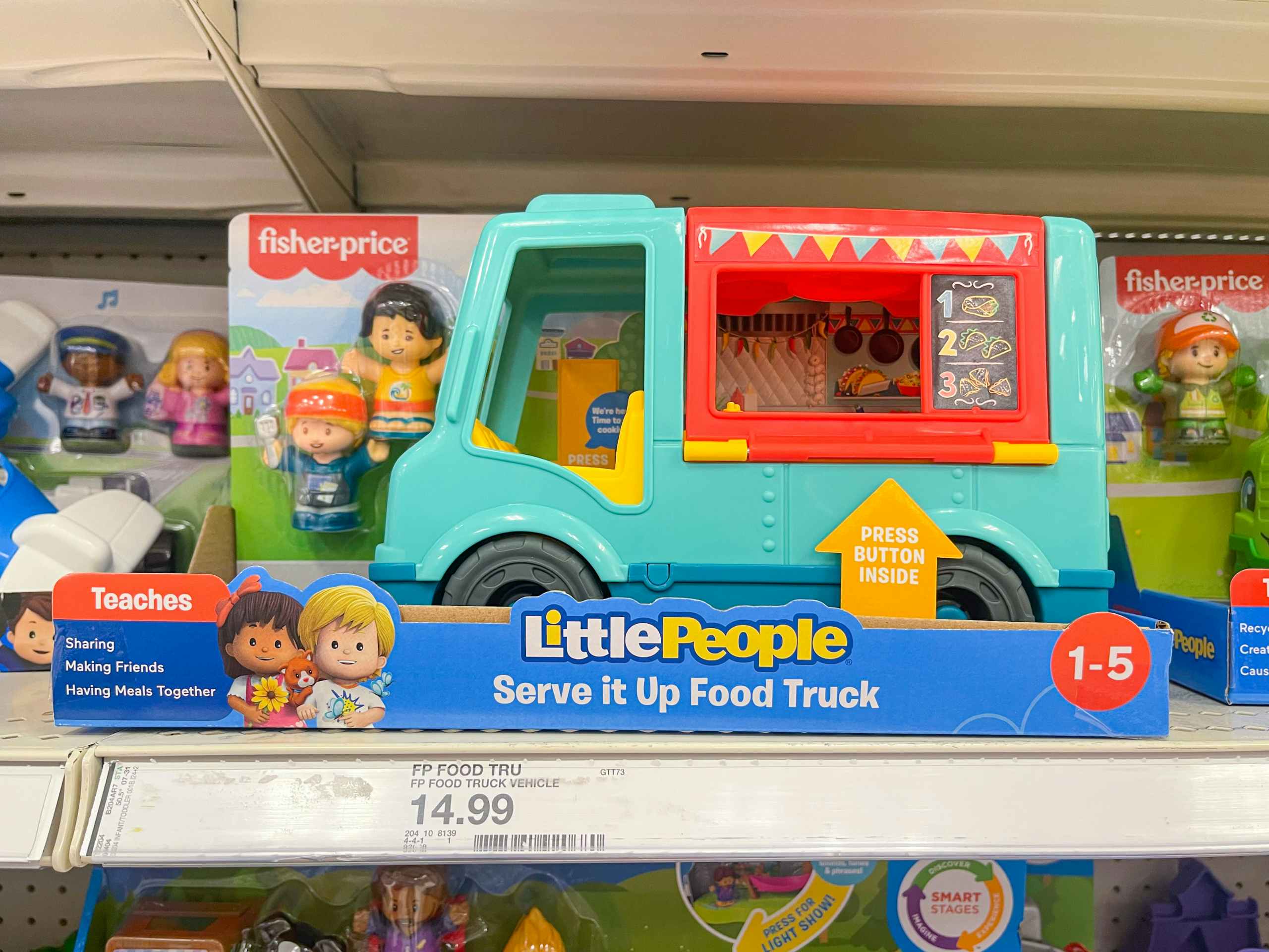 A Little People Food Truck toy sitting on a store shelf.