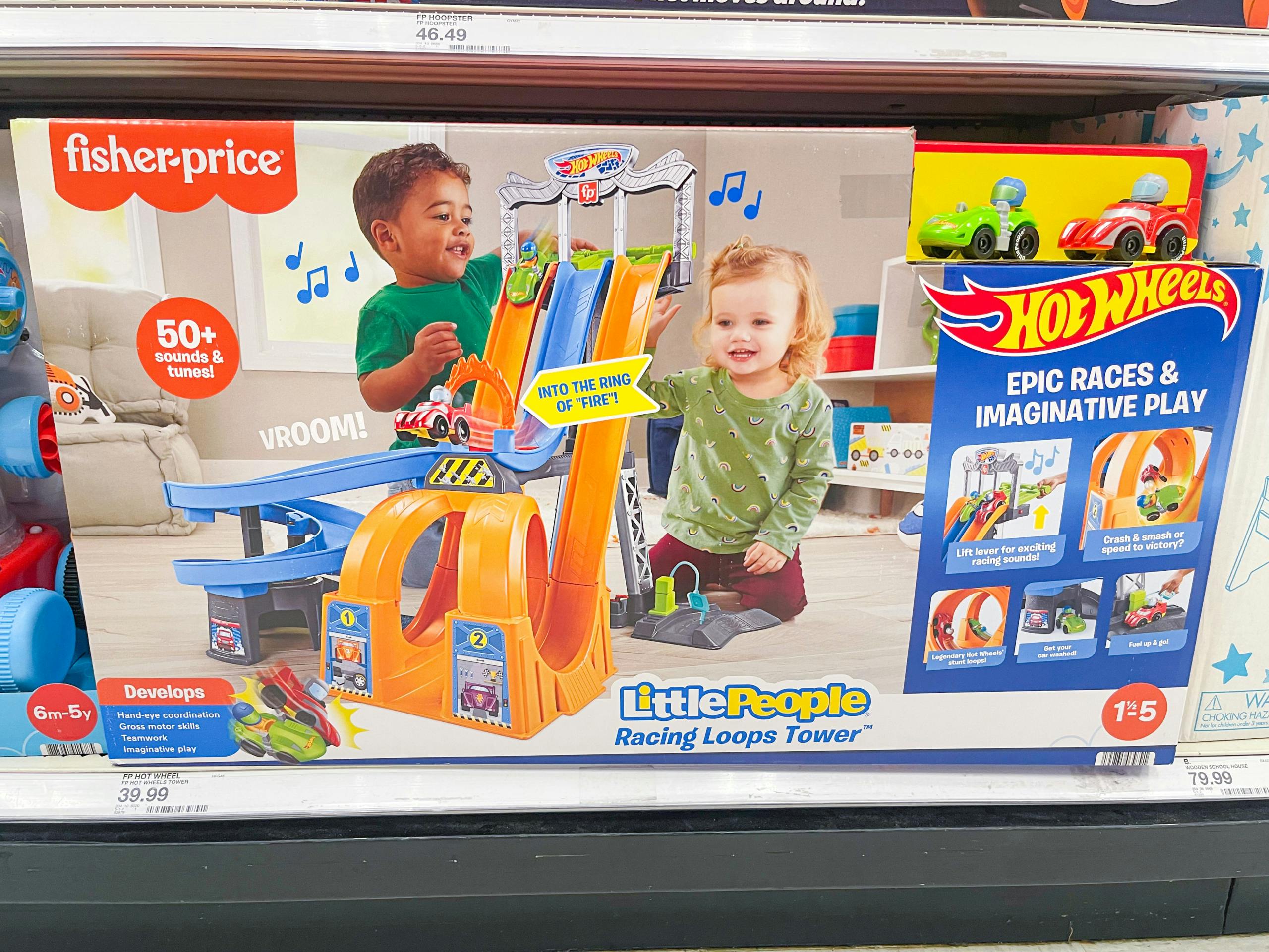 A Little People Hot Wheels Loops Track sitting on a store shelf.