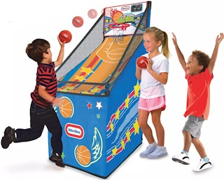 kids playing with a little tikes basketball game