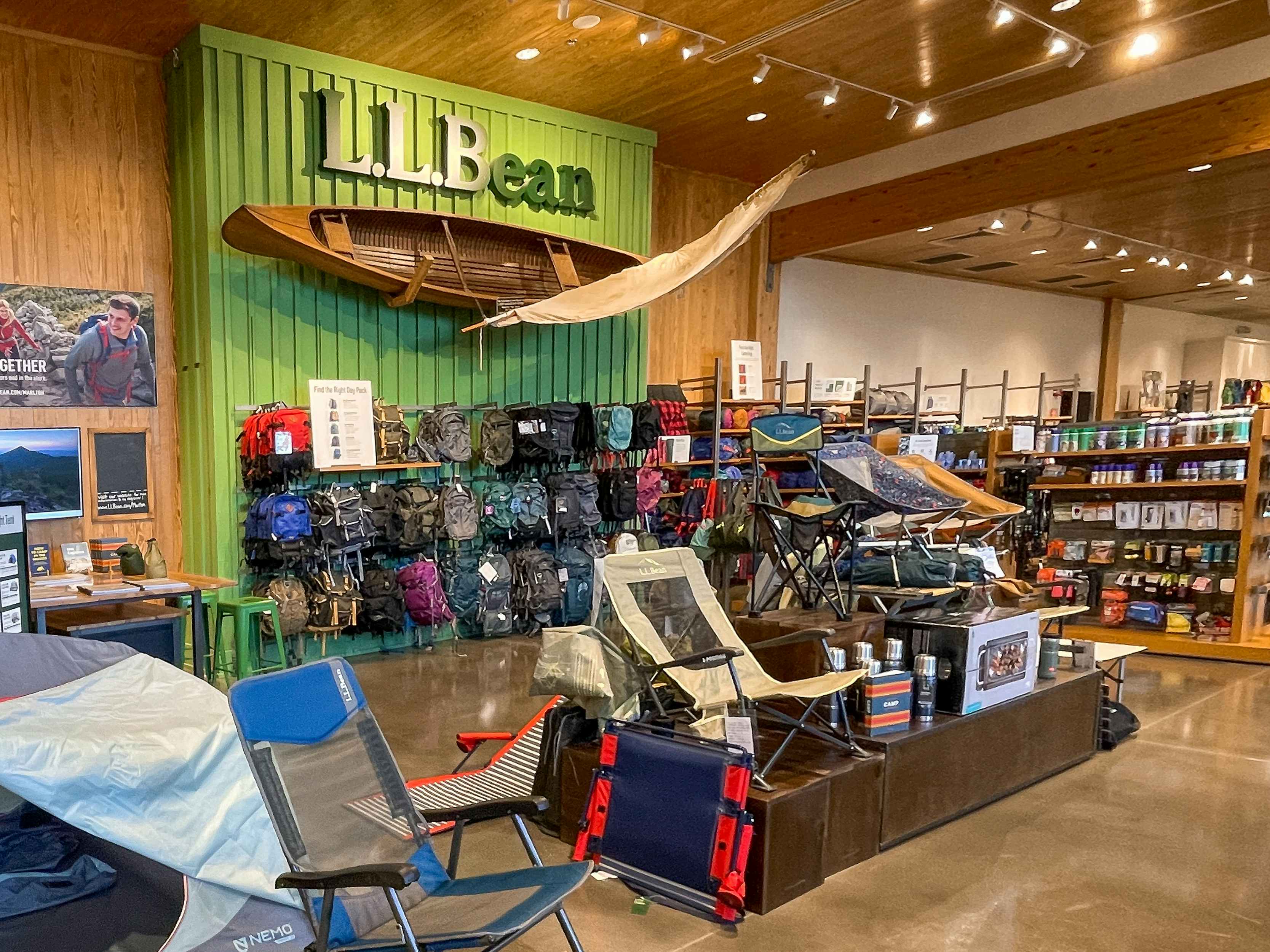 The inside of an L.L.Bean store showing products on display.
