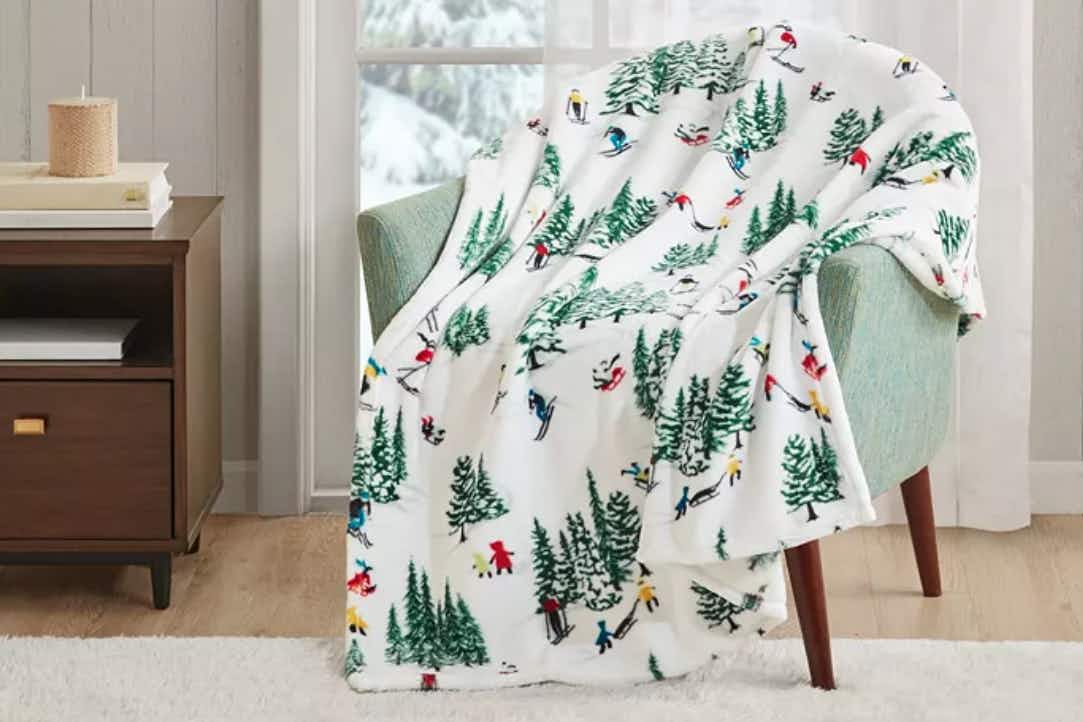 Screen shot of lifestyle image of holiday or christmas fleece blanket 