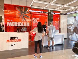 Someone waiting in line to return something at Nike