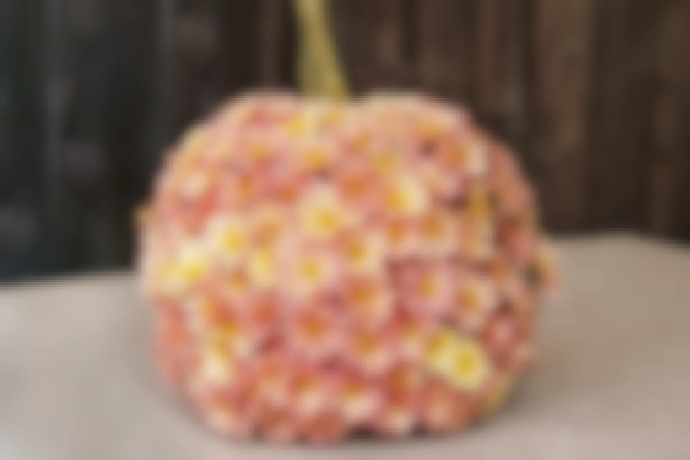no-carve pumpkin decorated with pink mums