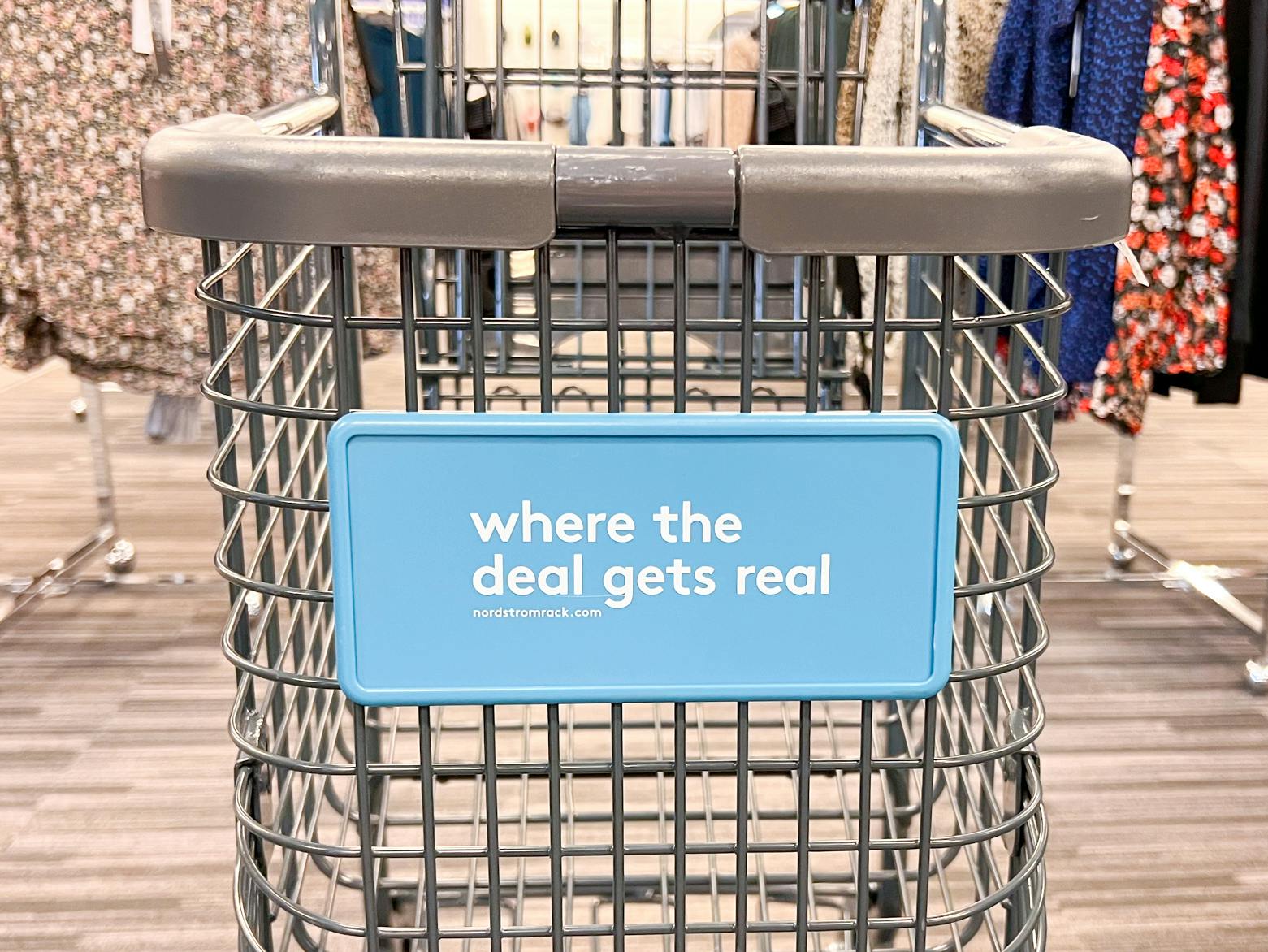 A Nordstrom Rack shopping cart in an aisle