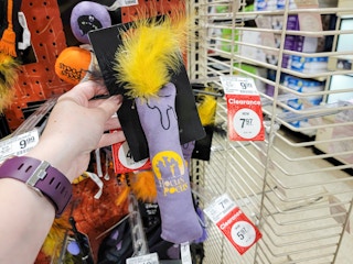 hand holding a candlestick hocus pocus cat toy