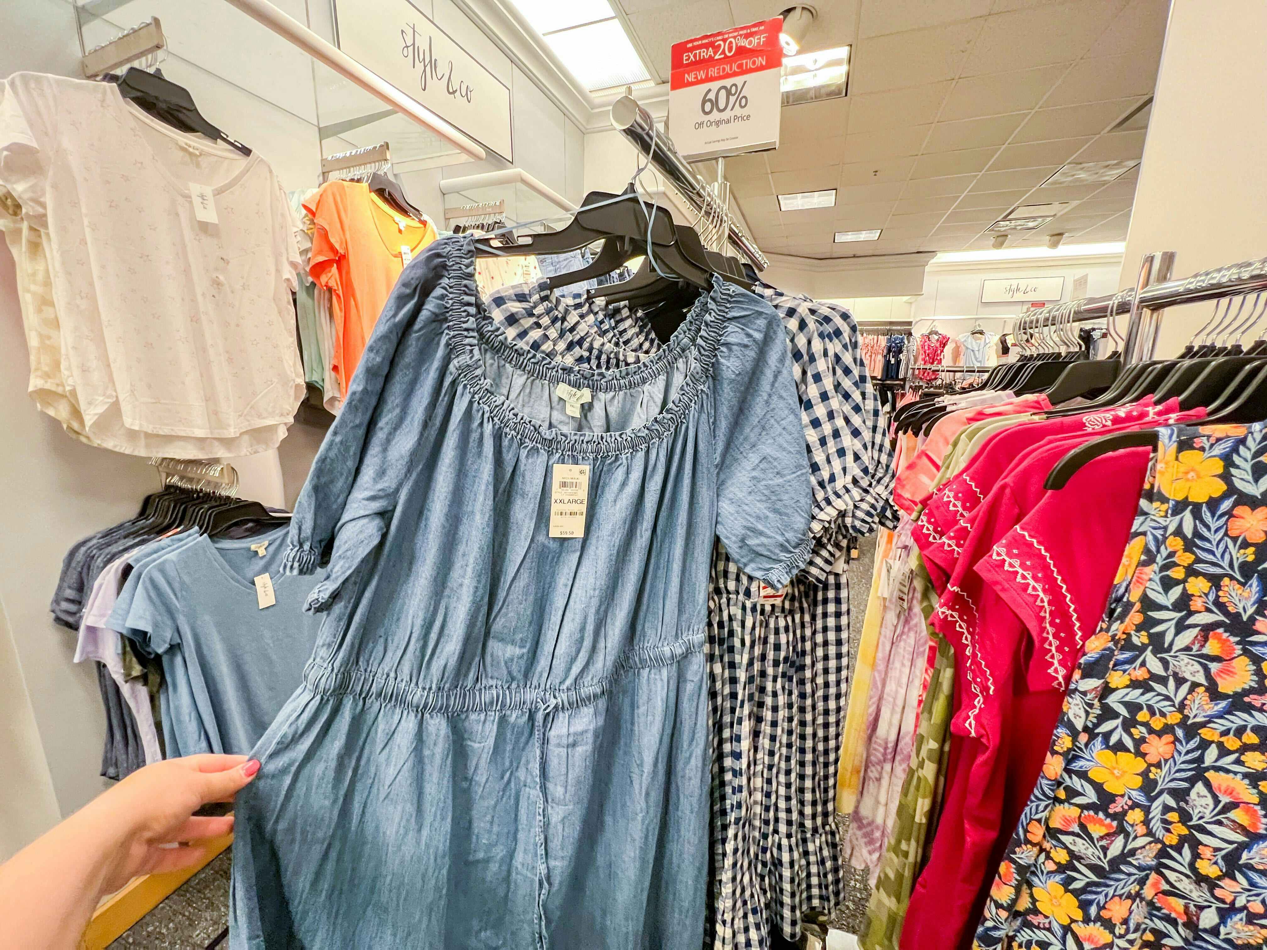 plus-size shirts hanging on a rack