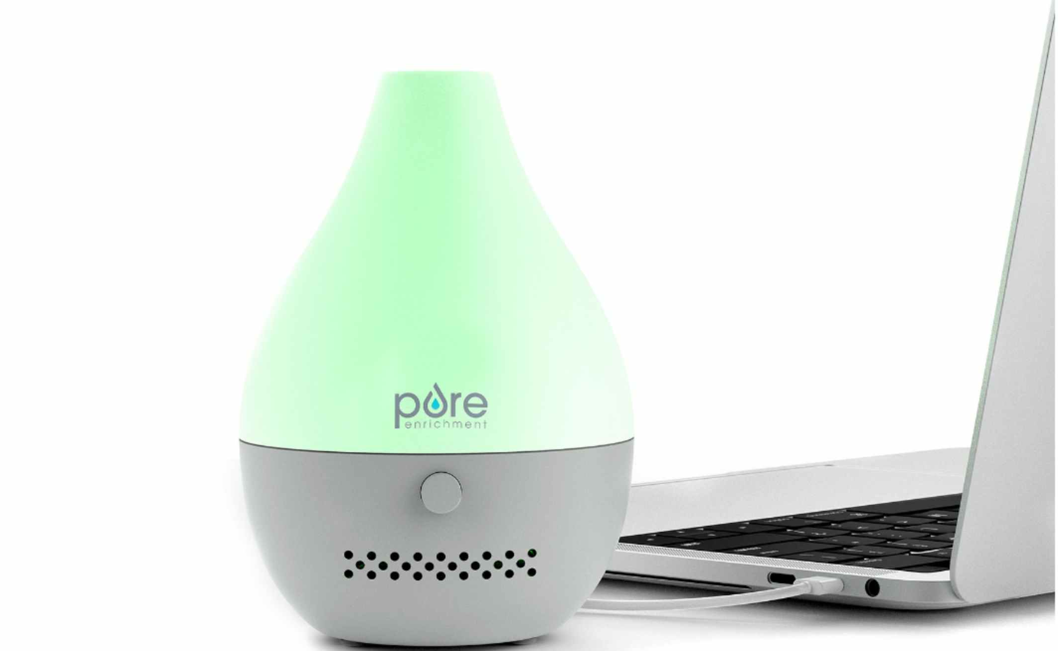a mini oil diffuser that is plugged into a laptop