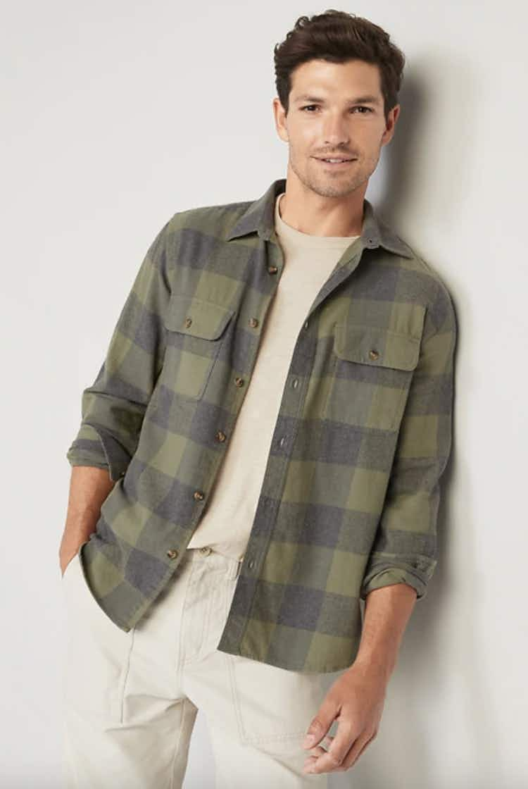 a man wearing a green flannel shirt