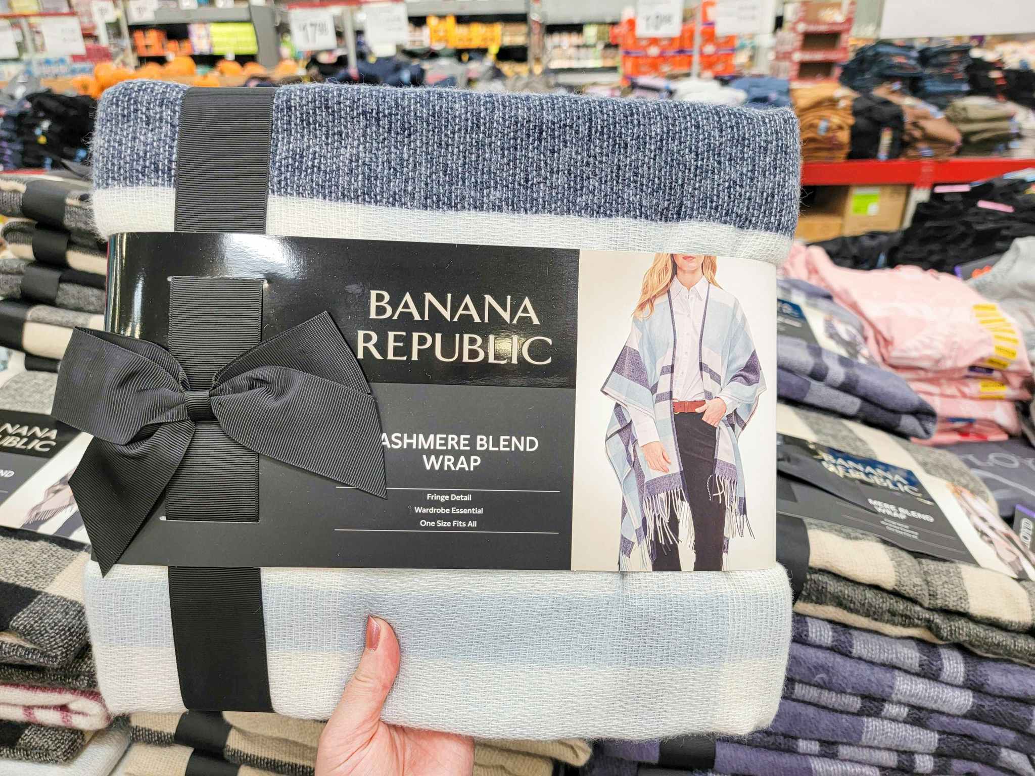 hand holding a blue plaid banana republic cashmere wrap
