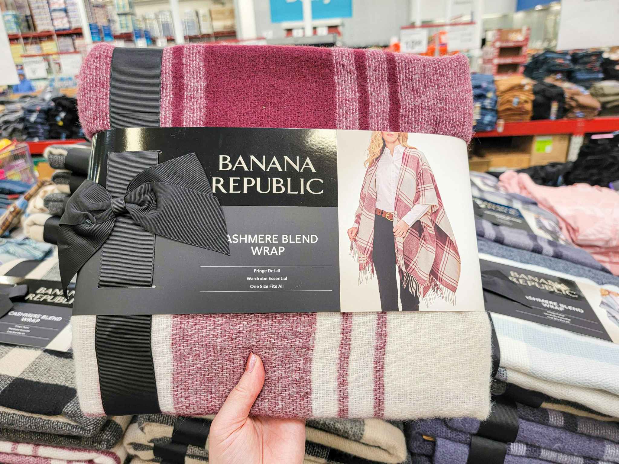 hand holding a burgundy plaid banana republic cashmere wrap