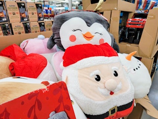 penguin and santa jumbo squishy plushes in a cart
