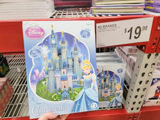 hand holding a 3d disney cinderella castle puzzle