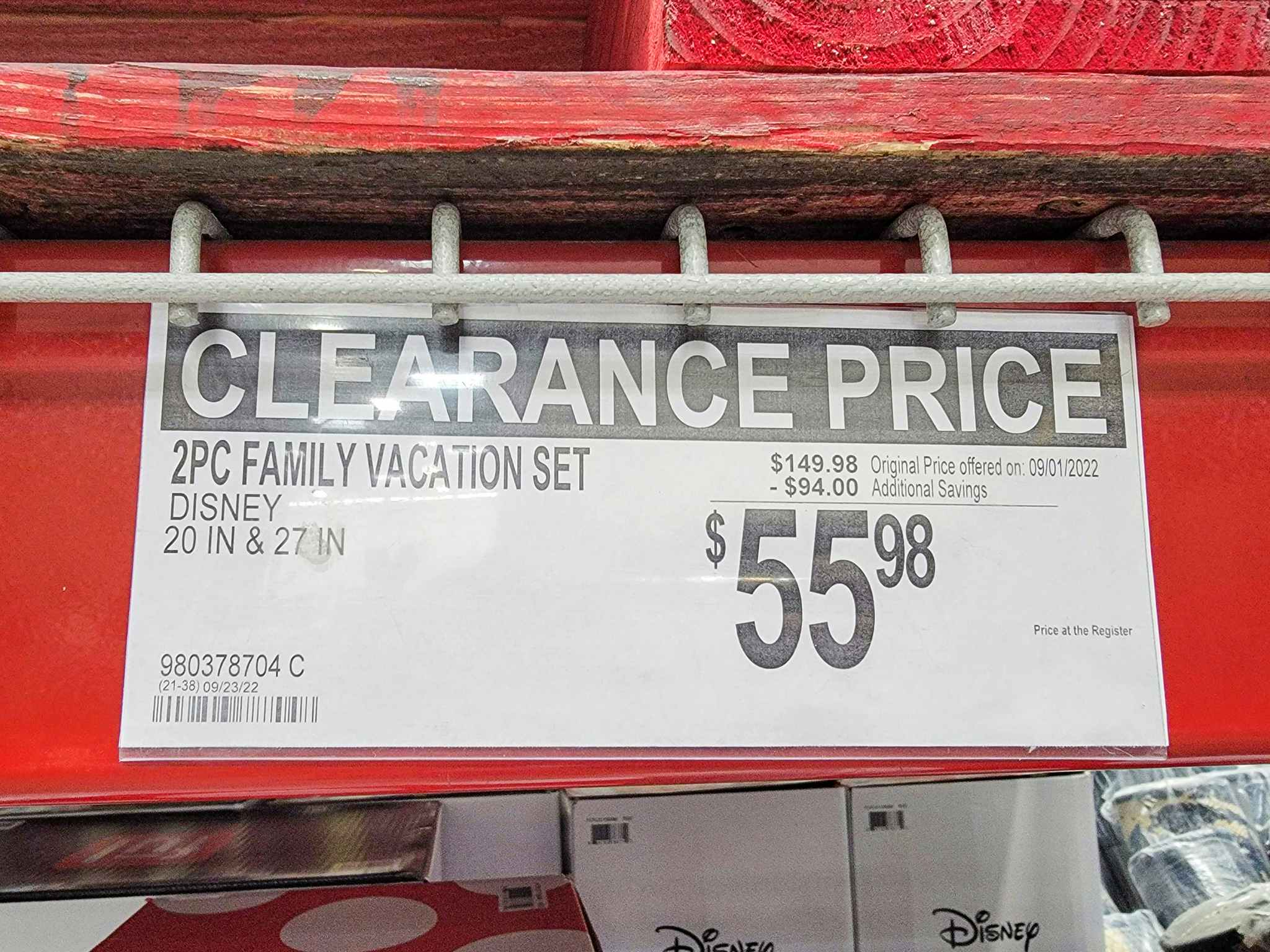 clearance sign for 55.98 disney luggage set