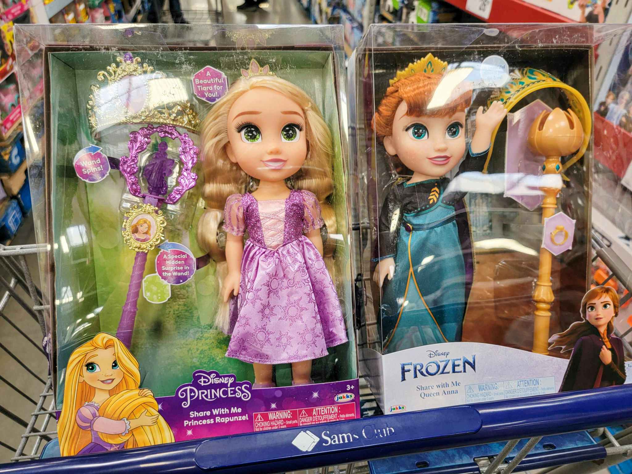 rapunzel and anna dolls in a cart