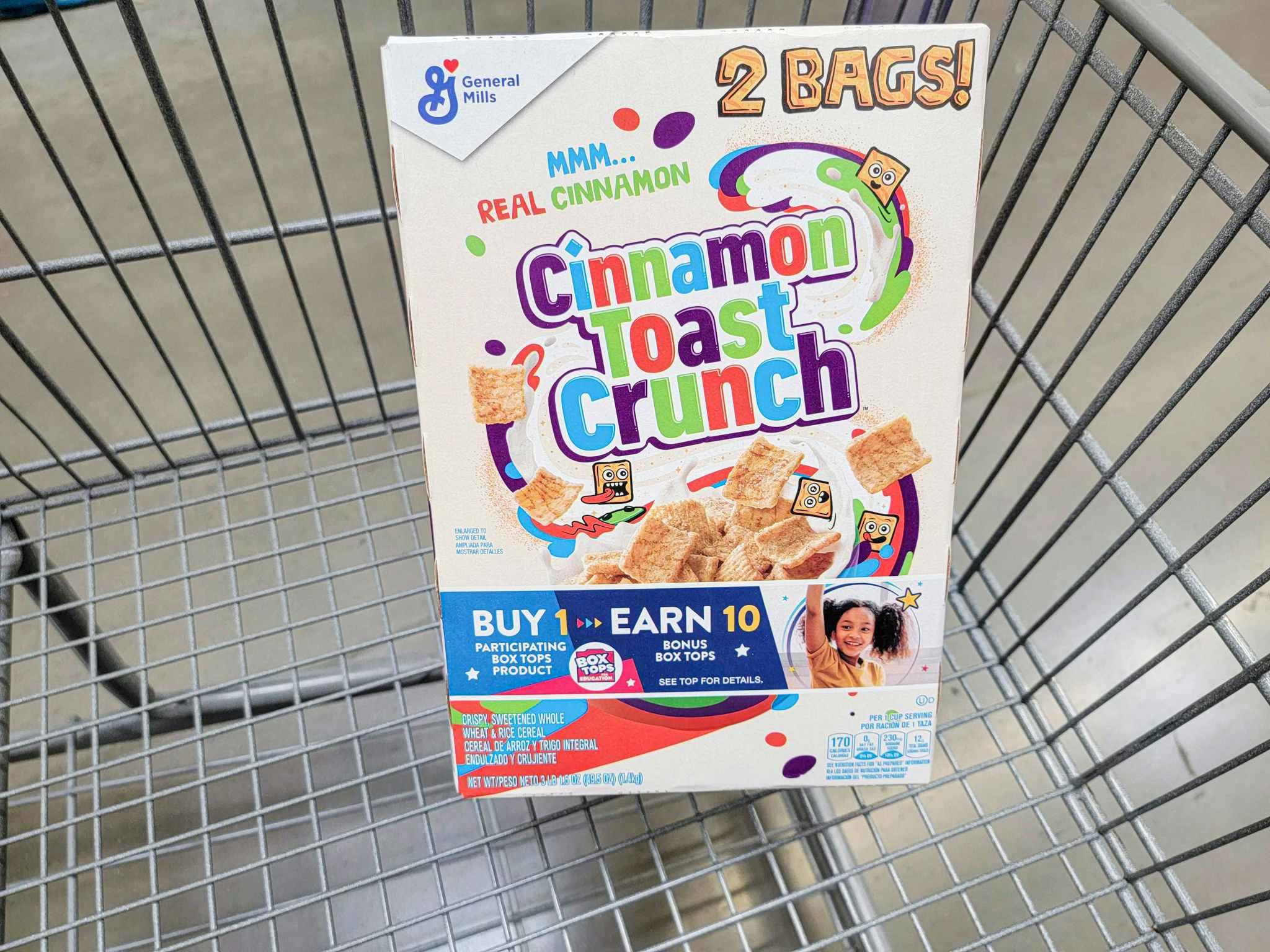 a large box of cinnamon toast crunch cereal in a cart