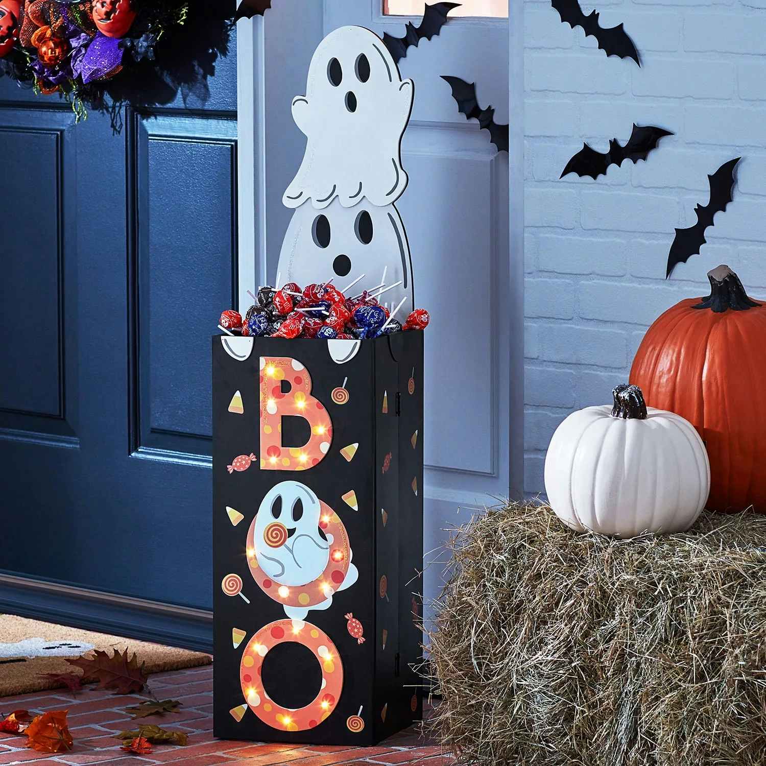 a candy door greeter with a ghost that says boo