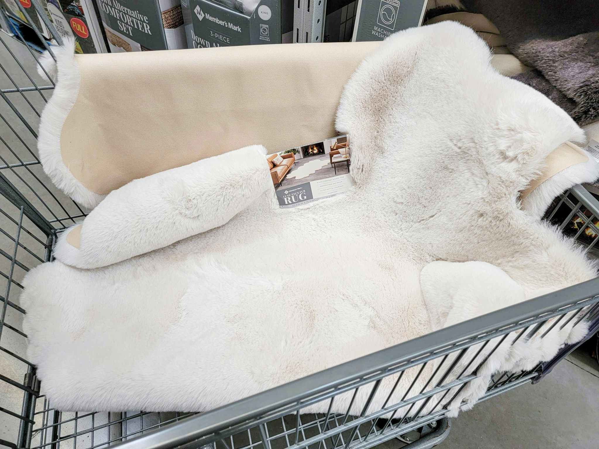 a cream faux fur rug in a cart