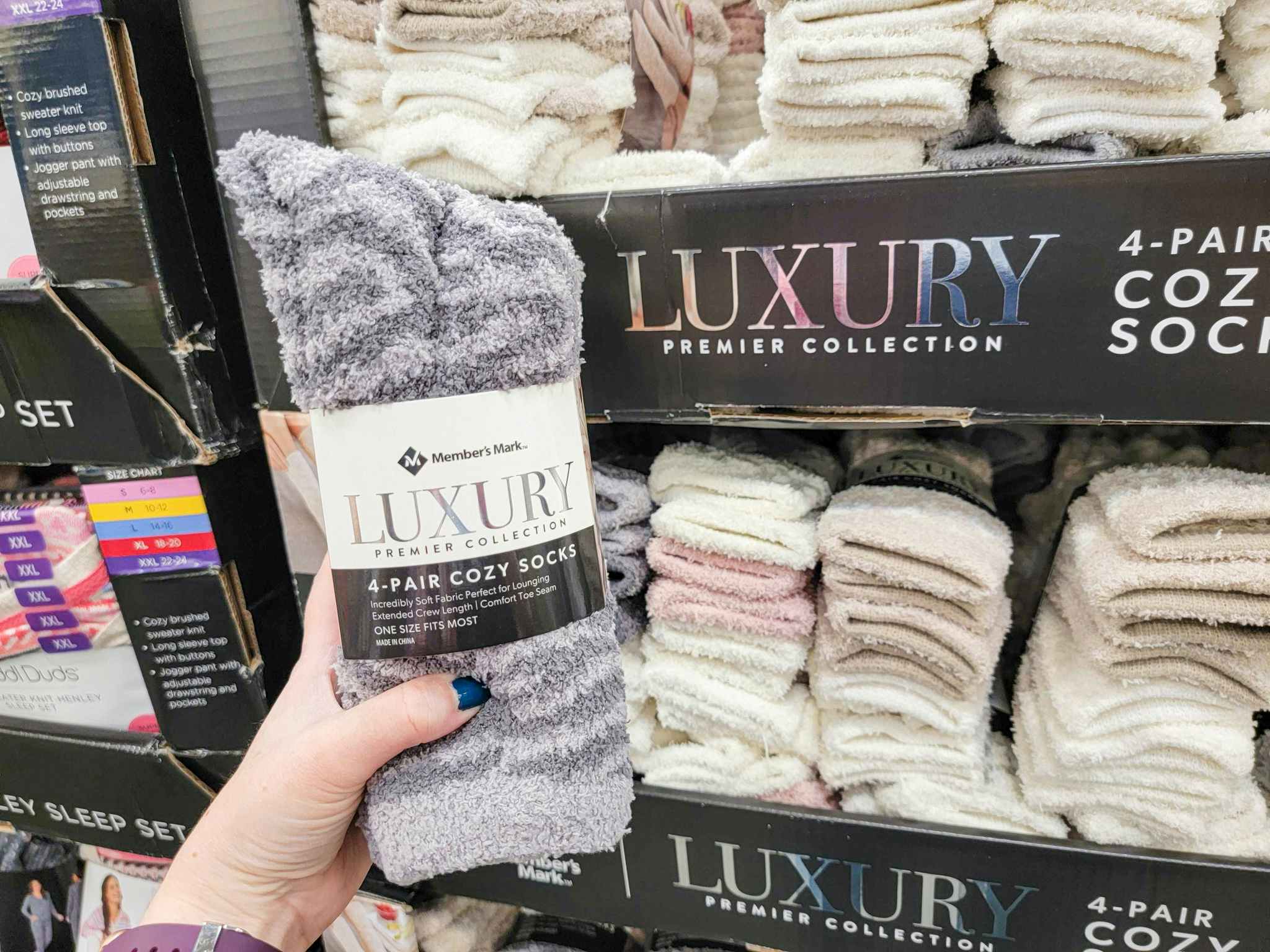 hand holding a 4 pack of cozy socks