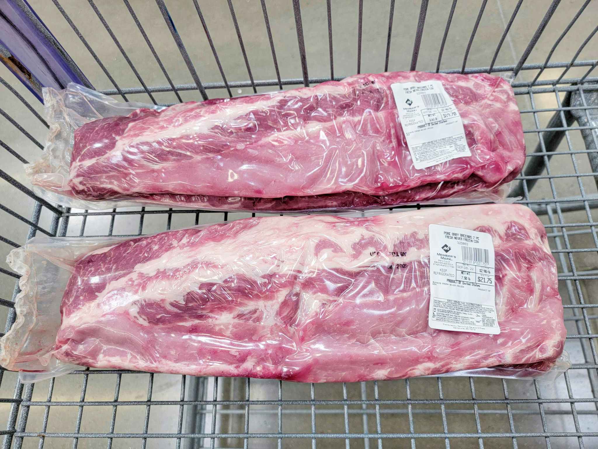2 packs of pork ribs in a cart