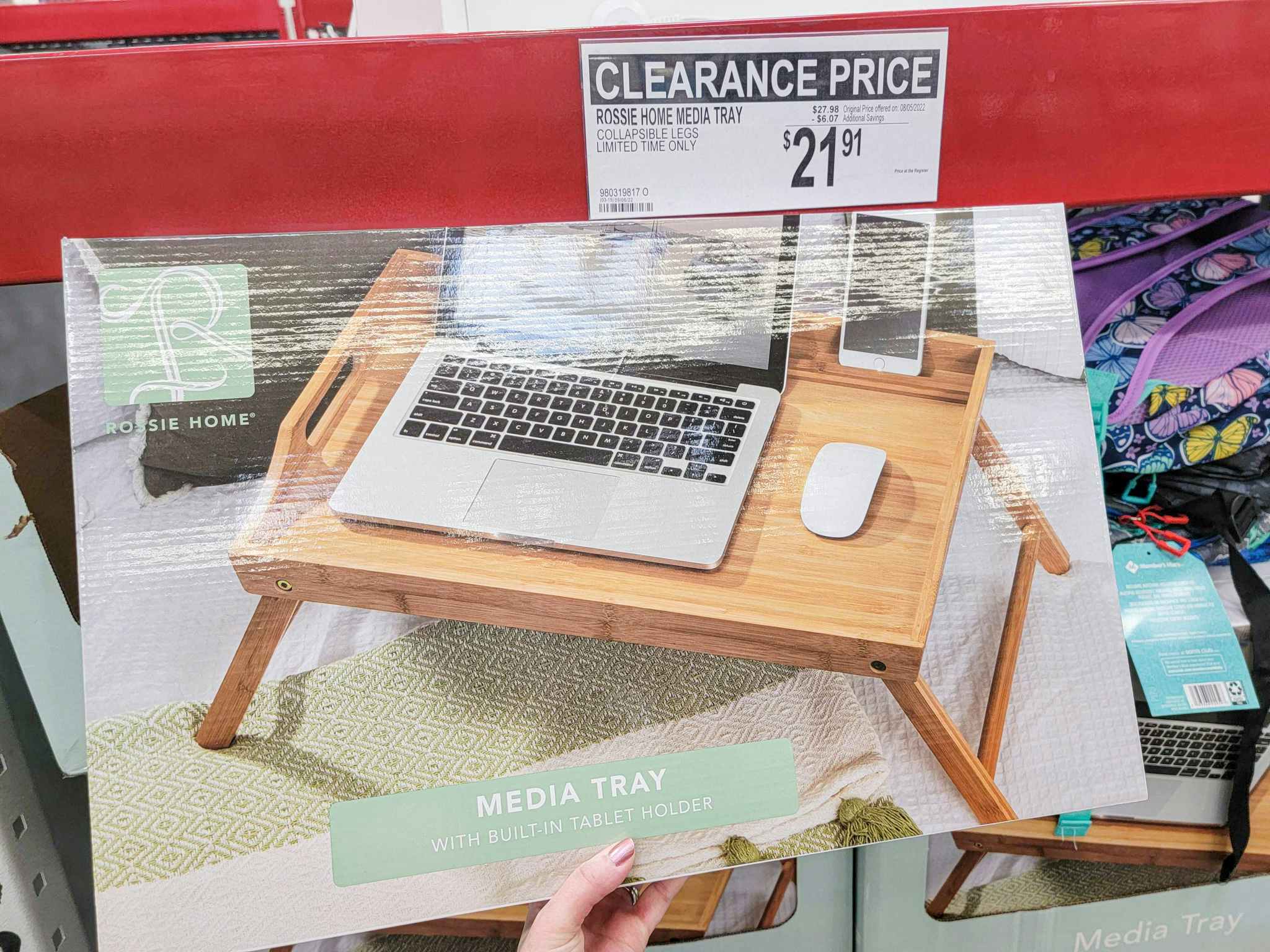 hand holding a box with a wooden media tray in it