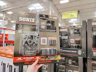 hand holding a sonix trail camera