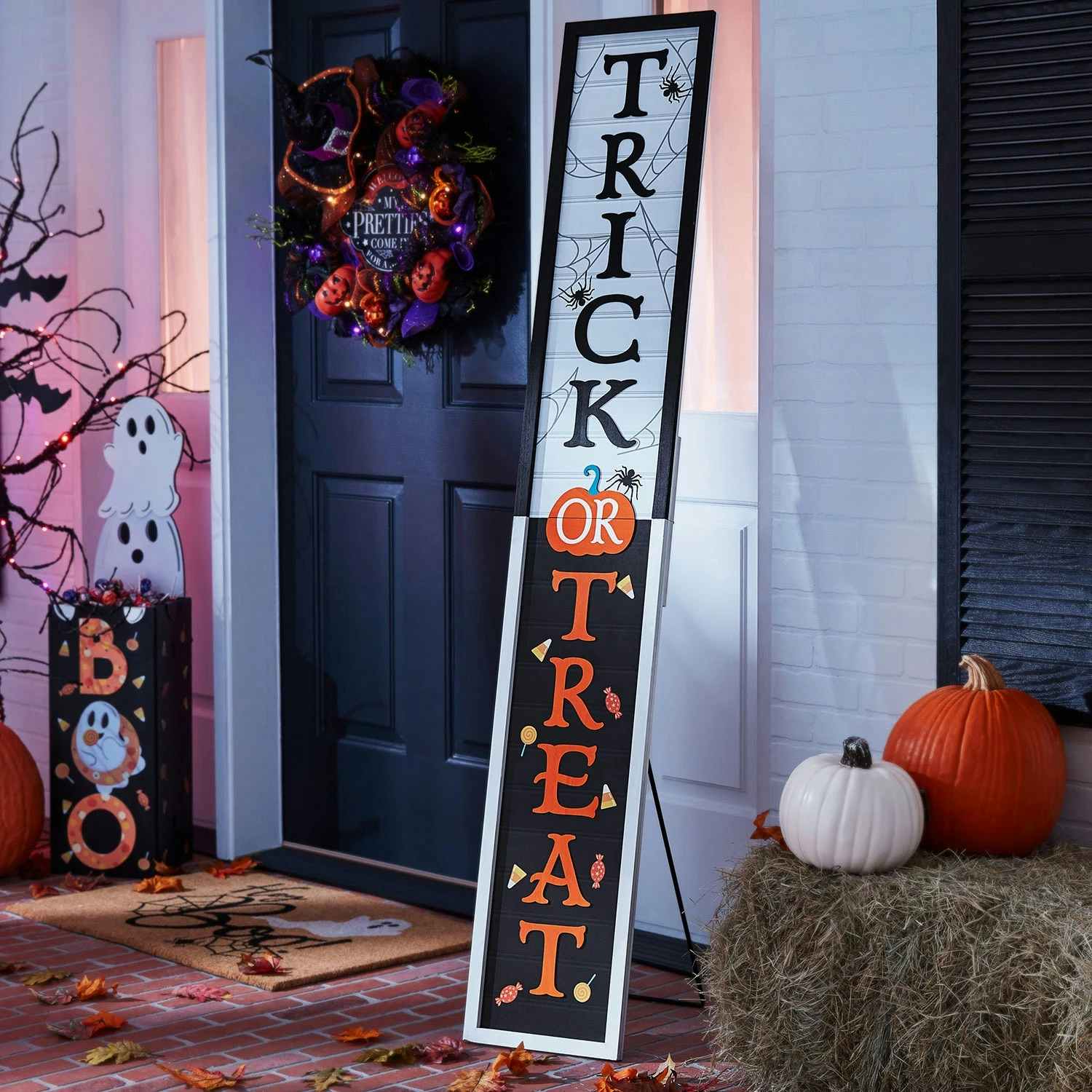 a tall trick or treat porch sign