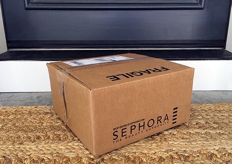 sephora box sitting on front porch welcome mat