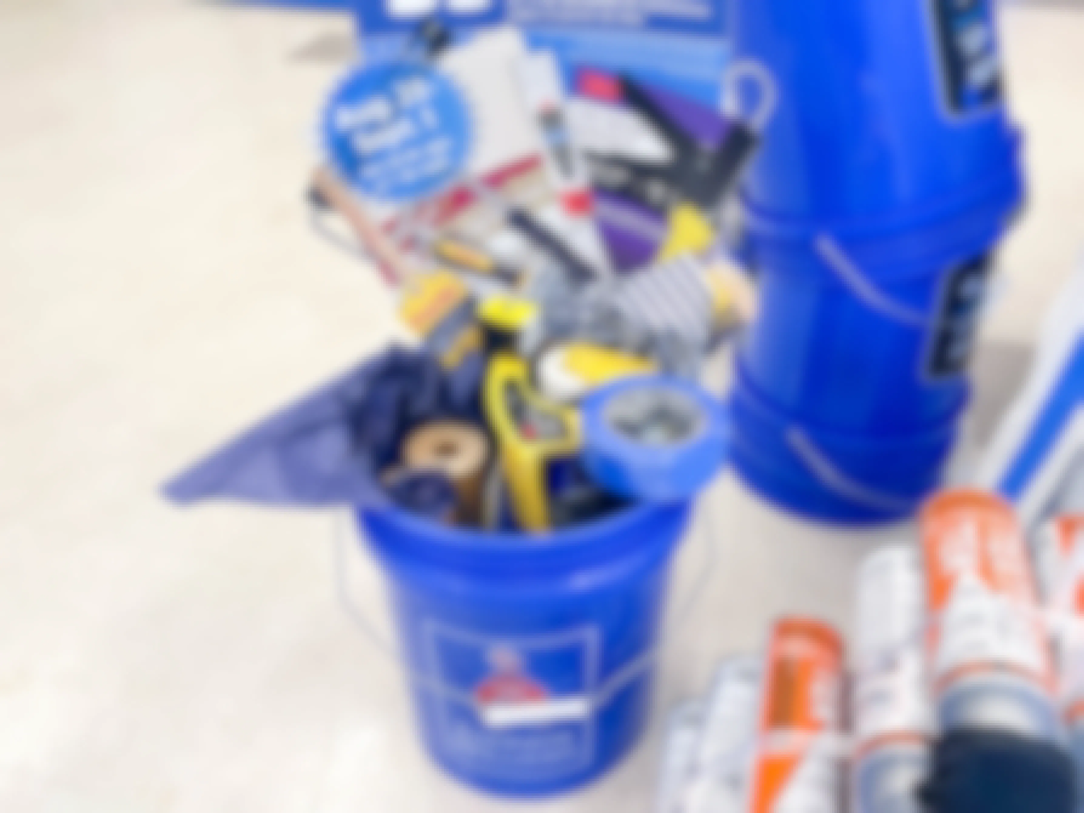 a blue bucket full of painting supplies at Sherwin Williams