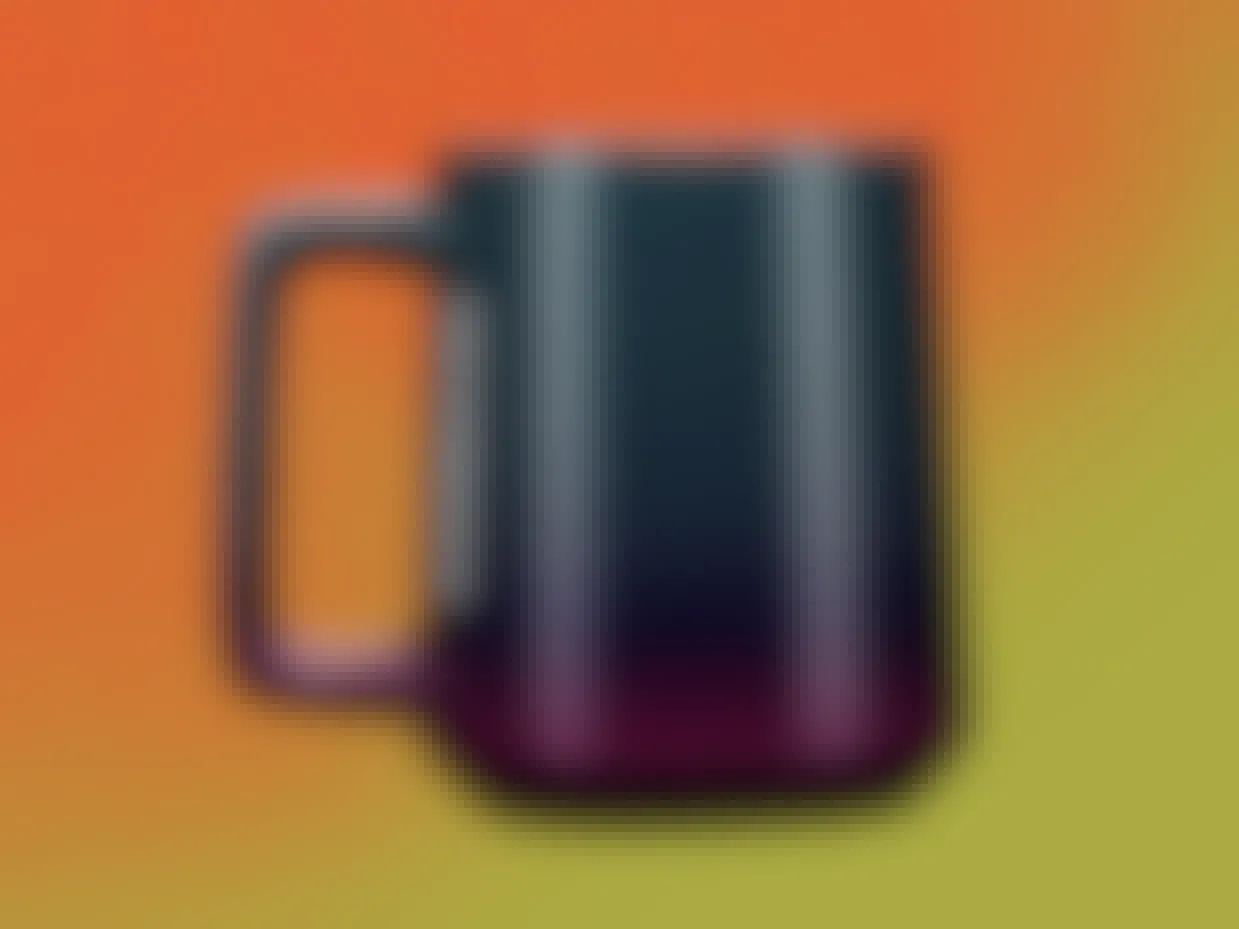 A Starbucks mug on a colorful background.