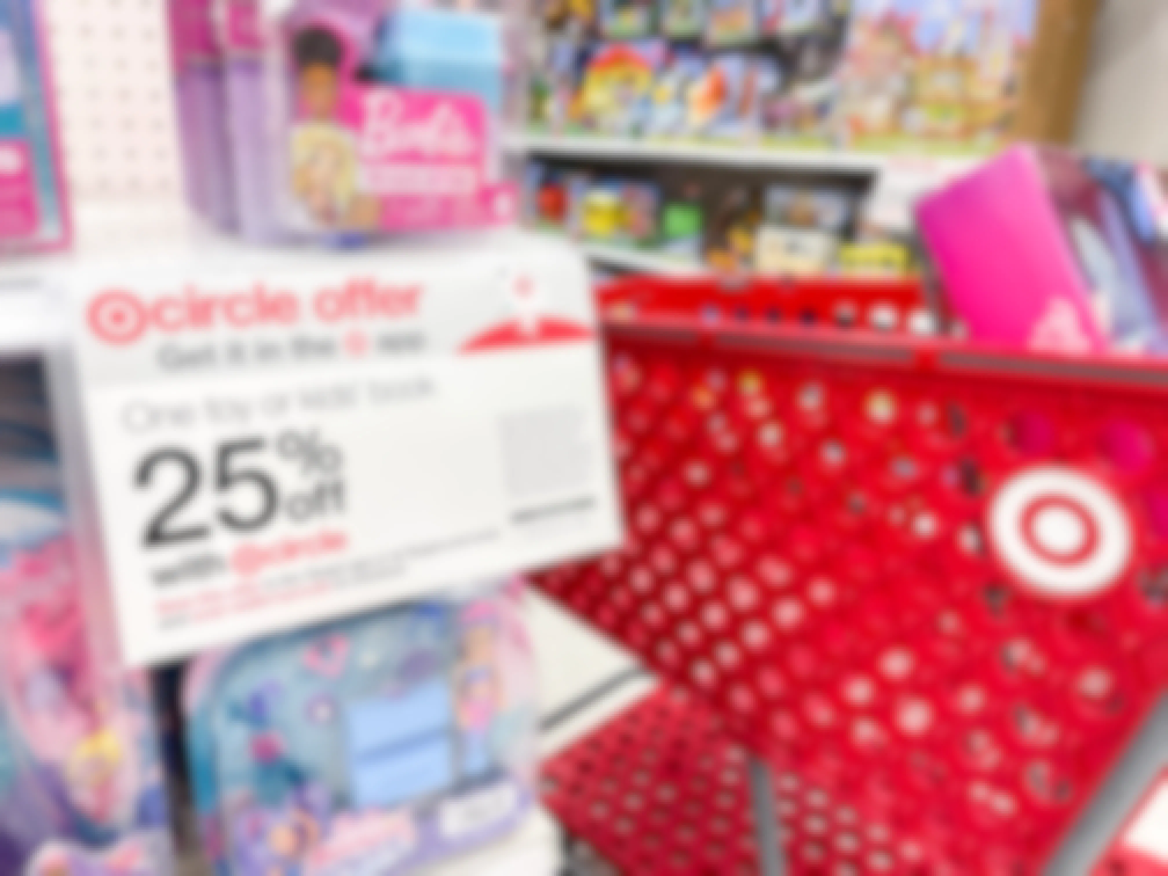 A target shopping cart with a barbie doll set in it next to a Target Circle sign that says 25% off one toy or kids' book