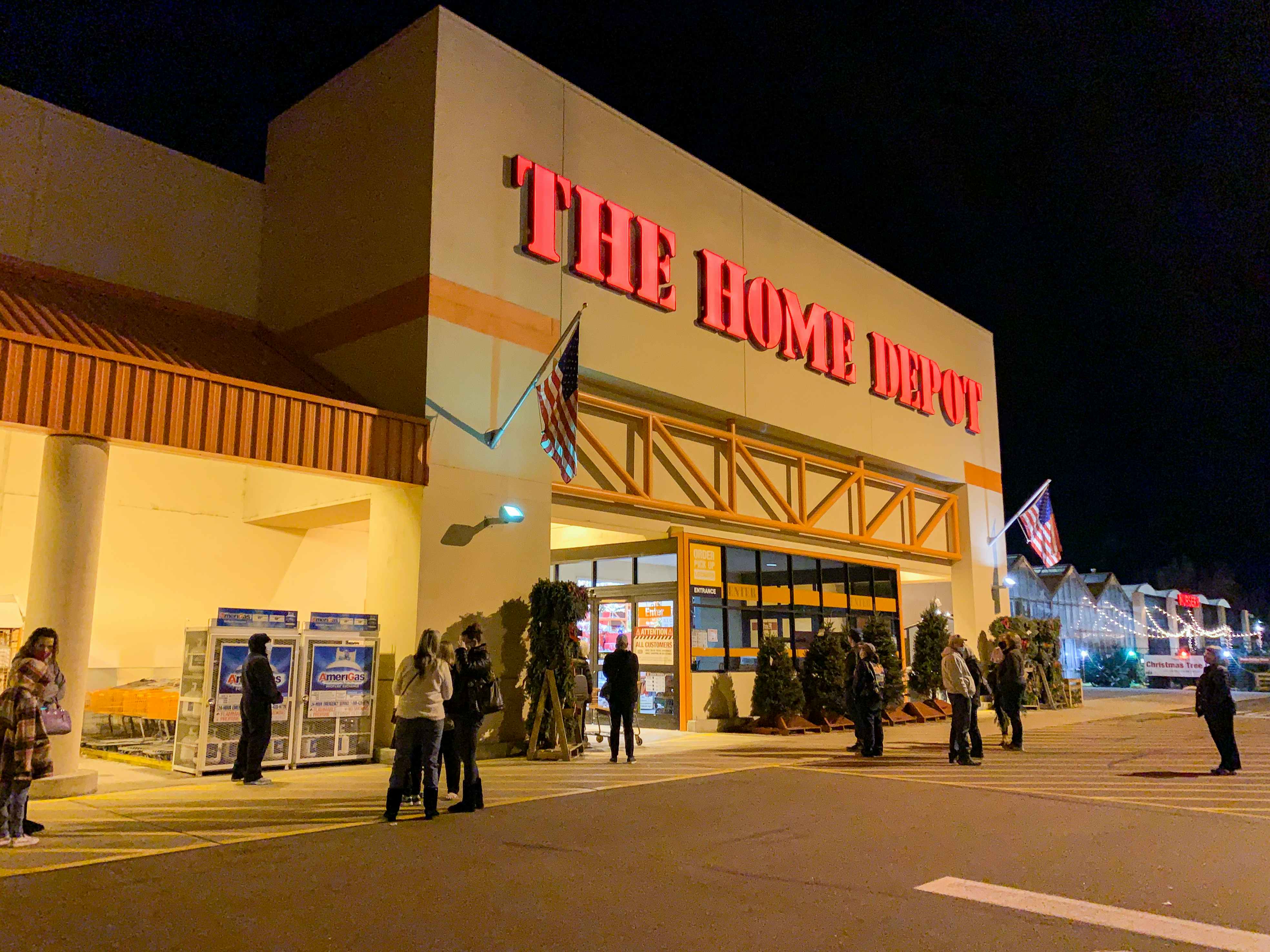 People standing outside of a Home Depot store.