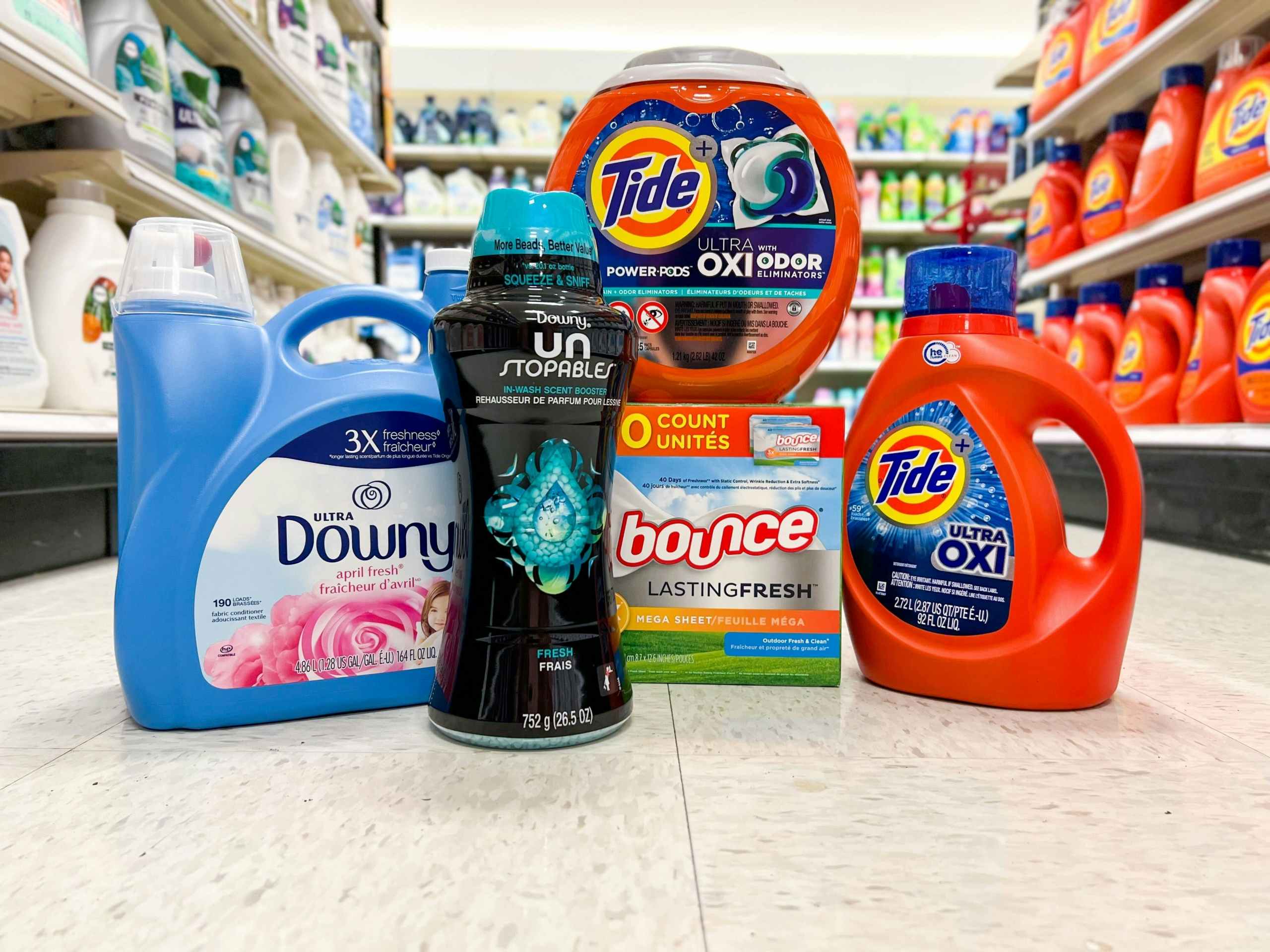 tide, downly, and bounce laundry products in a target aisle