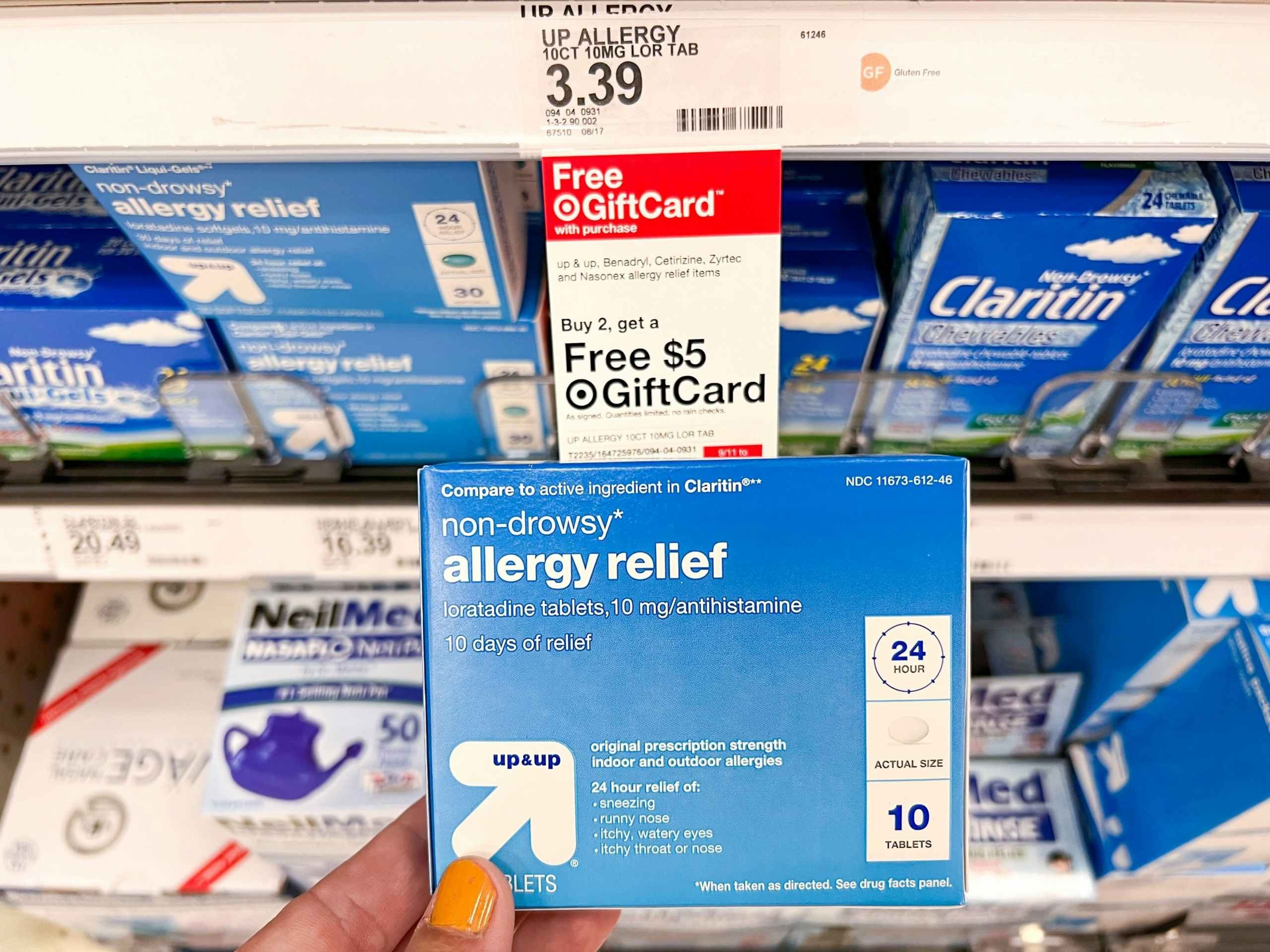 hand holding up & up allergy relief in front of target promotion tag