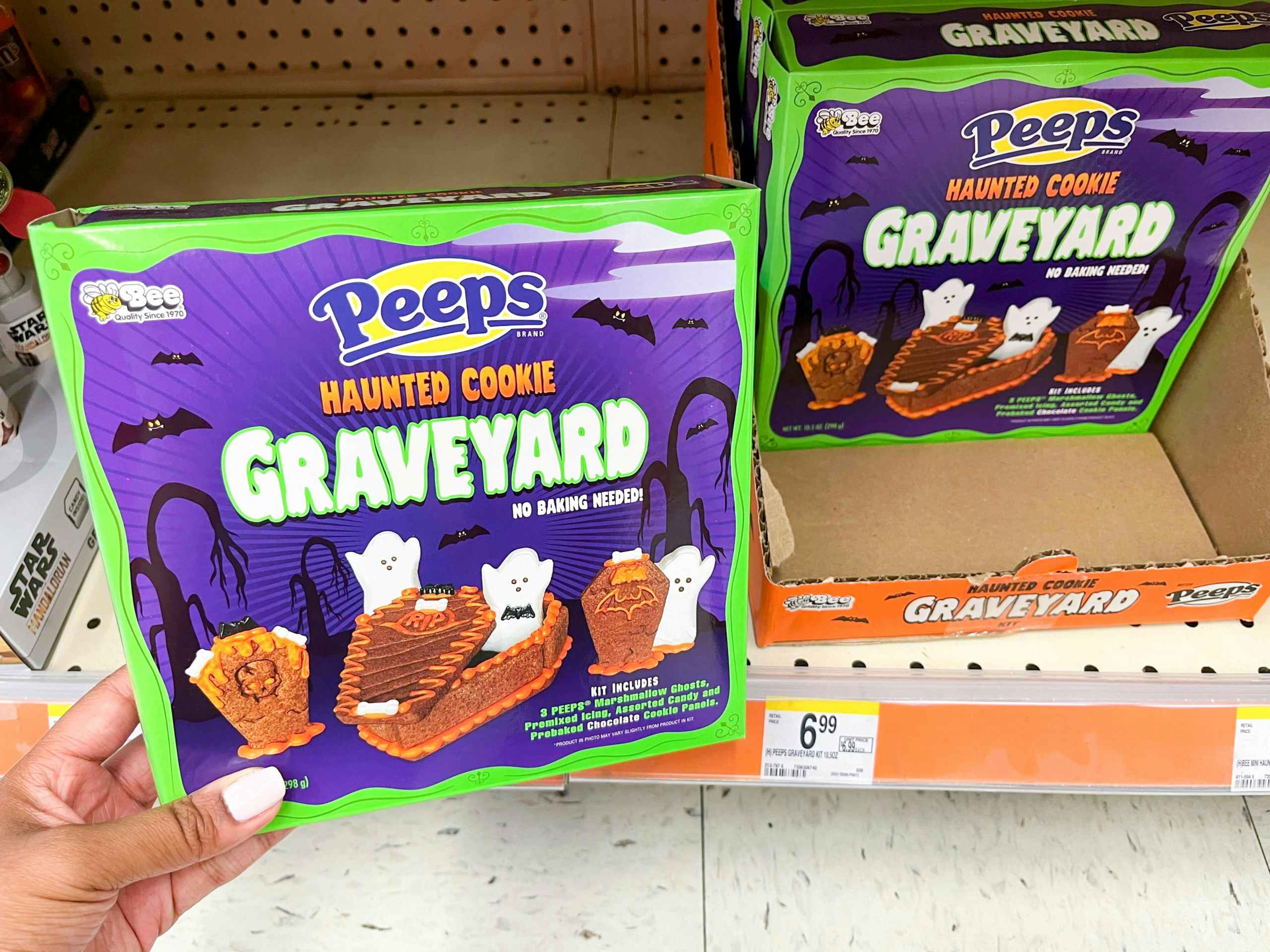 hand holding Peeps Haunted Cookie Graveyard box in front of price tag